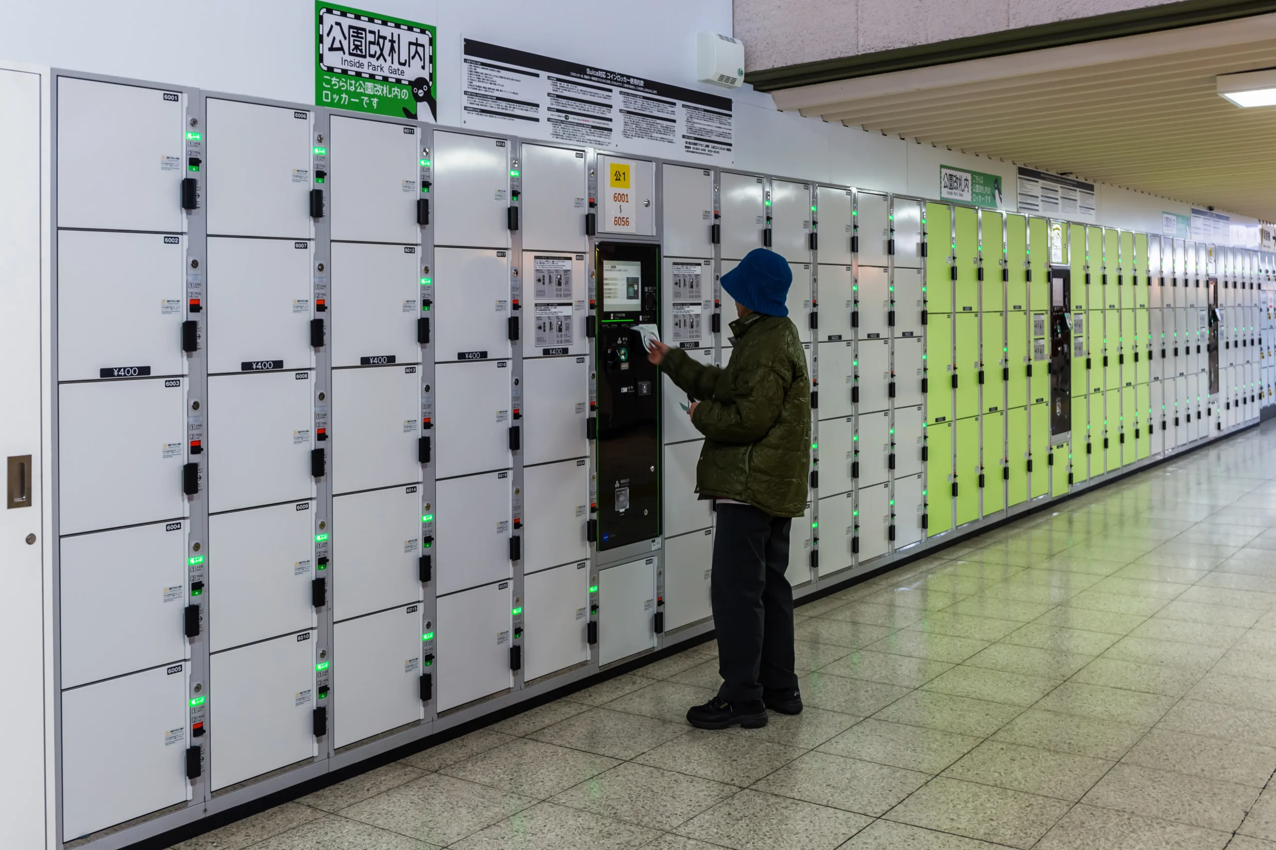 woman using a coin locker in japan