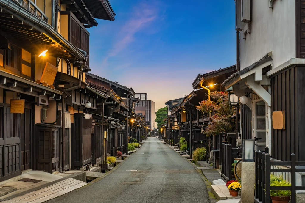 A well-preserved historical district with traditional wooden houses, narrow streets, and a quiet evening ambiance.