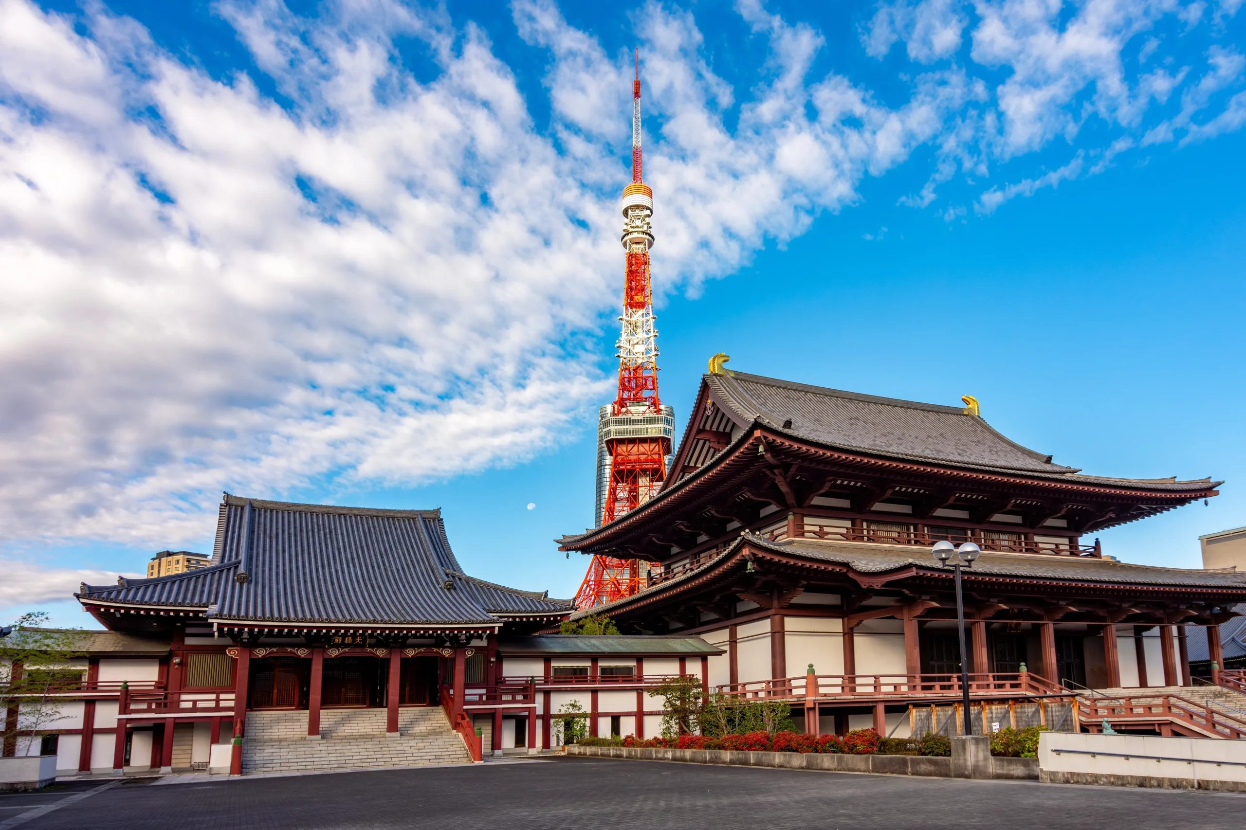 Zojoji Temple with Tokyo Tower in the background on a clear spring day in Tokyo