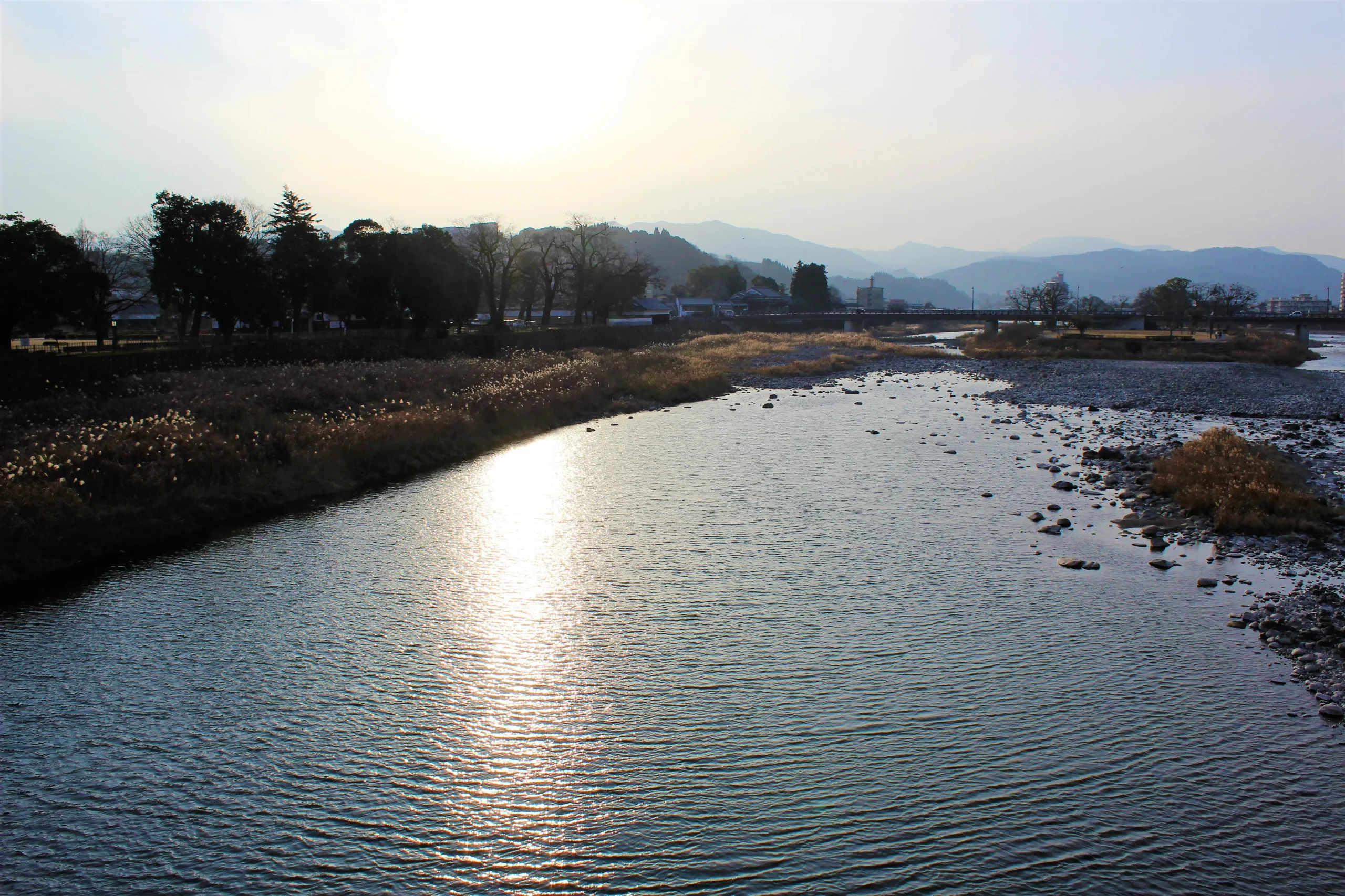 Scenic view of the Kuma River winding through lush green mountains in southern Japan