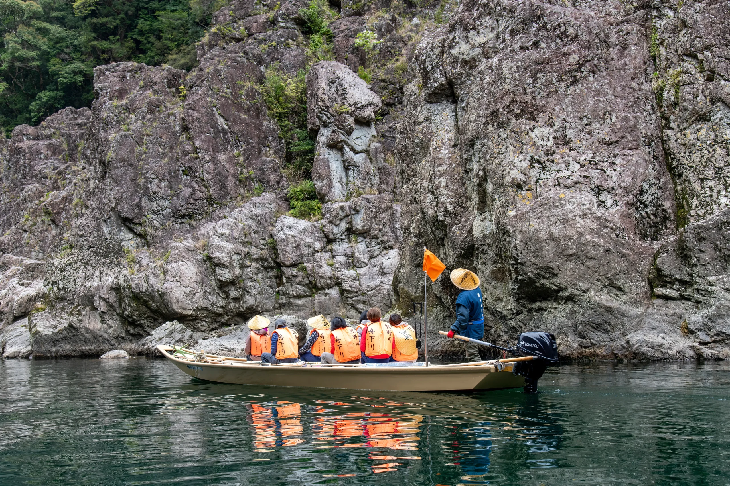 Tourists enjoy a guided boat cruise on the scenic Kuma River in southern Japan