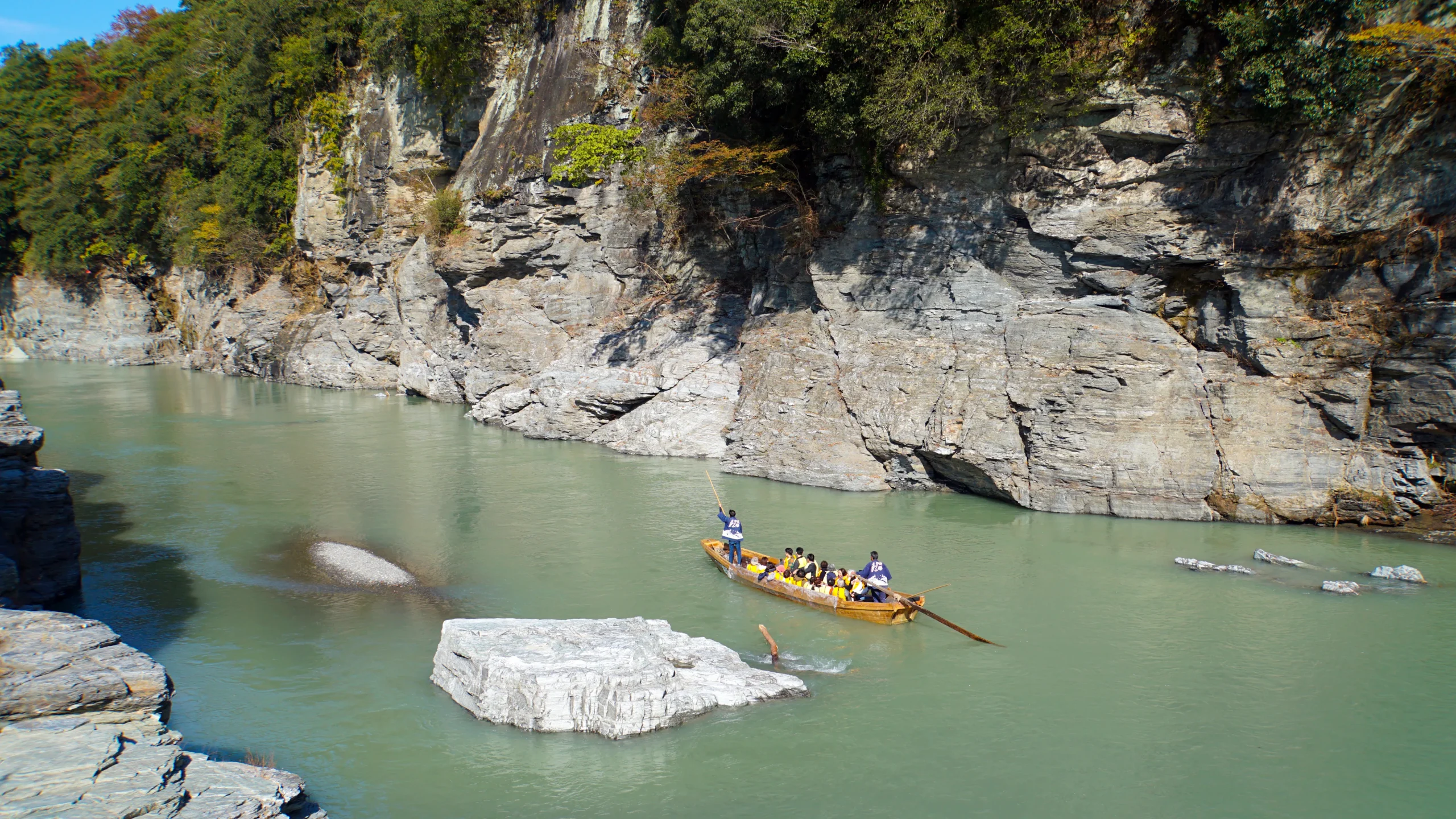 Traditional wooden boat glides through rocky gorges on Nagatoro River cruise