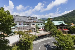 Historic Fujiya Hotel in Hakone with traditional architecture and mountain views.