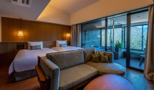 Modern twin room with private onsen and forest view at FUFU Hakone luxury ryokan.