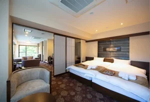 Modern suite room at Hakone Nanase with forest view and spacious layout.