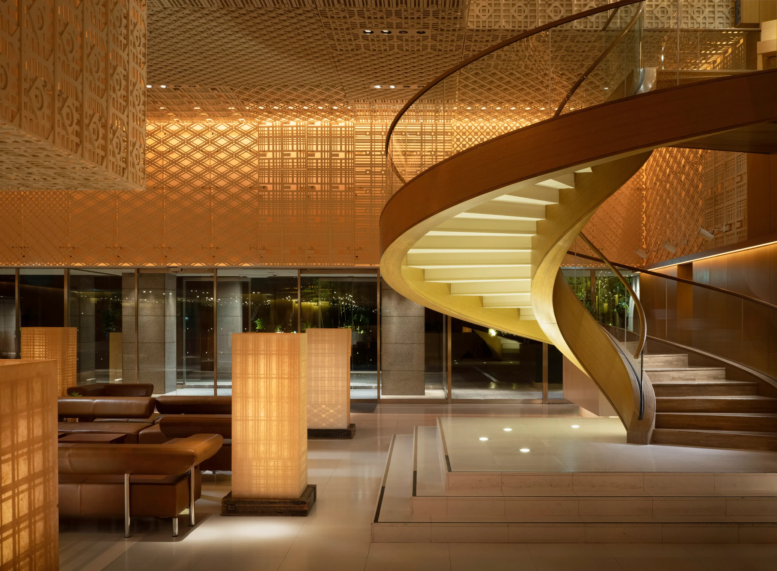 Elegant hotel lobby at Hyatt Regency Kyoto featuring a spiral staircase and modern Japanese décor.