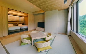 Modern Japanese-style suite at The Grand Blissen Hotel Jozankei with tatami and forest views.