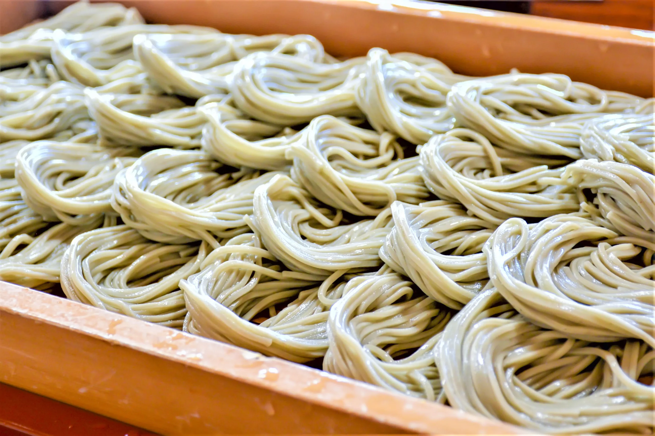 Freshly made hegi soba noodles arranged in wooden tray, a Niigata specialty 