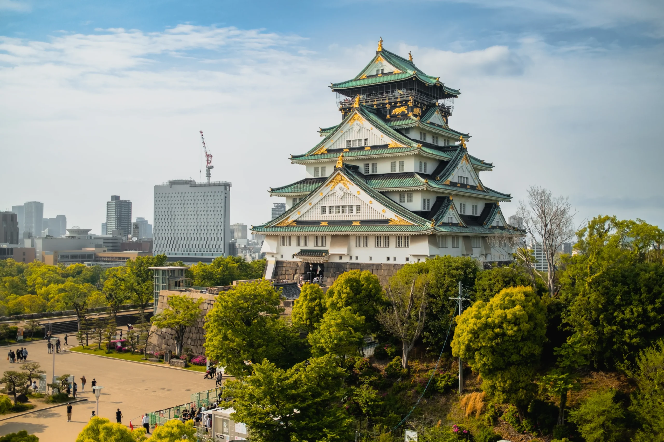 Osaka Castle with city skyline in background, a historic landmark in Osaka, Japan