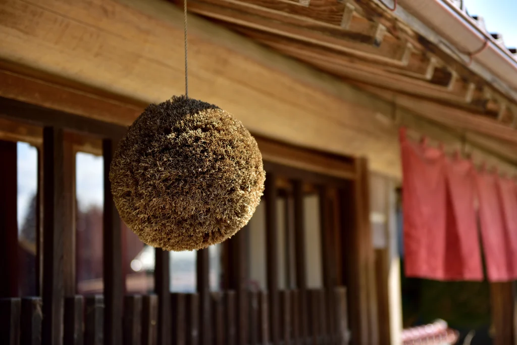 Sugidama cedar ball hanging outside a traditional Japanese sake brewery