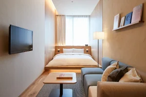 Cozy room at THE OSAKA STATION HOTEL with wood accents