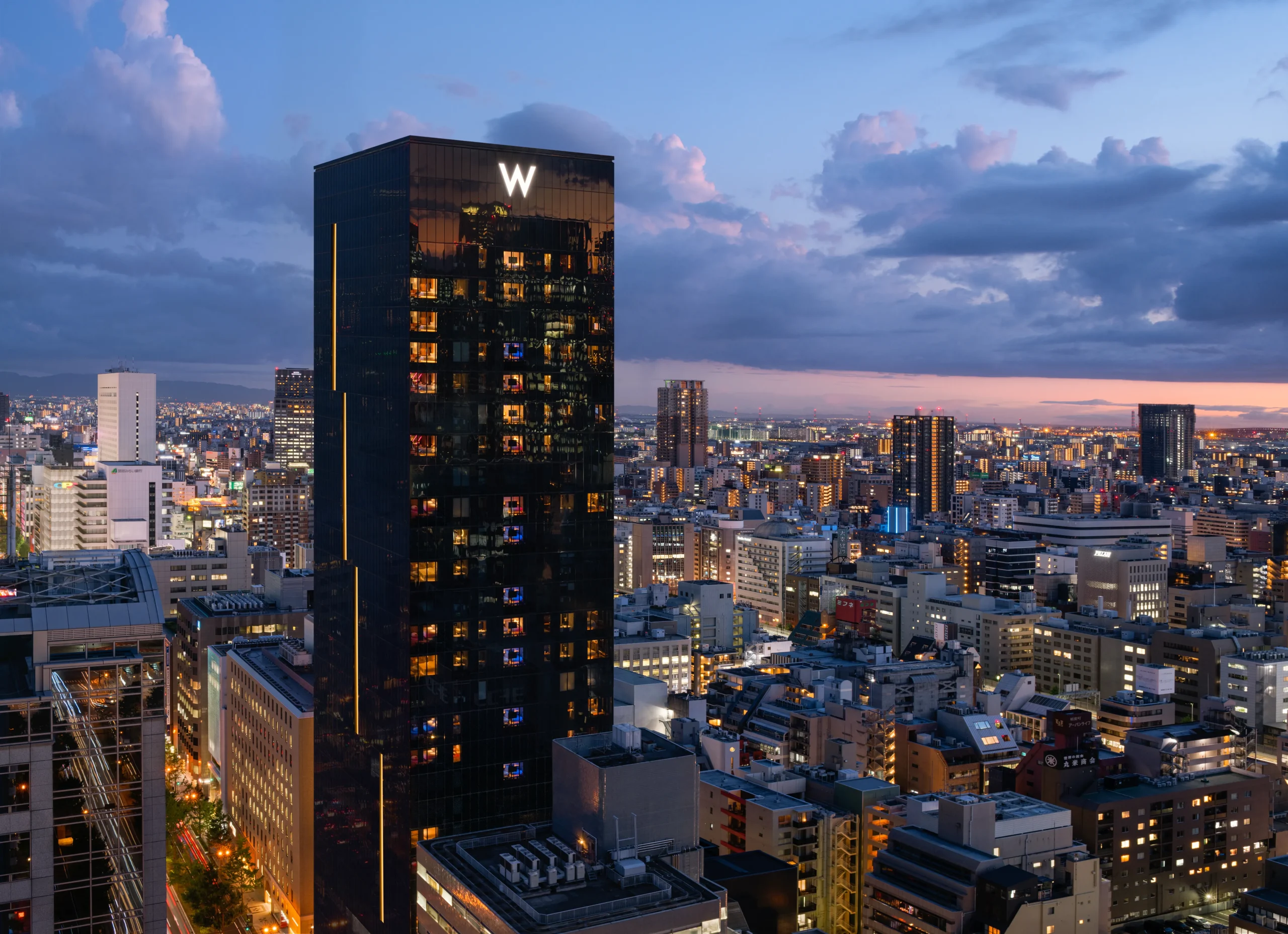 W Osaka hotel tower with panoramic city view during twilight
