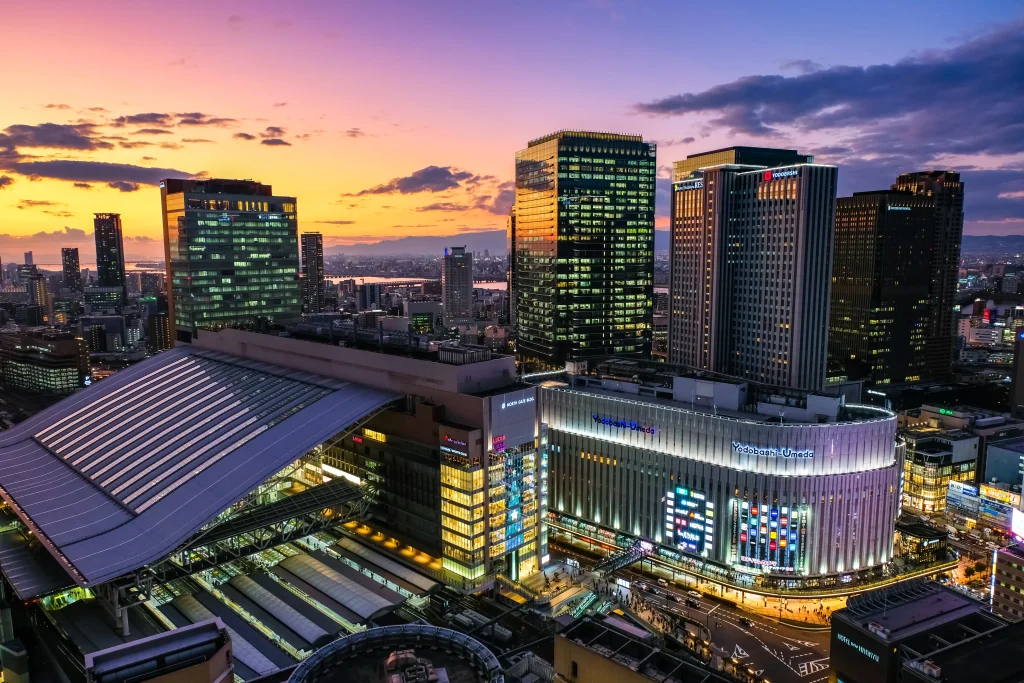 Umeda Osaka skyline at sunset featuring Osaka Station and Yodobashi camera