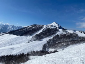 Panoramic winter mountain landscape at Yuzawa ski area with blue sky