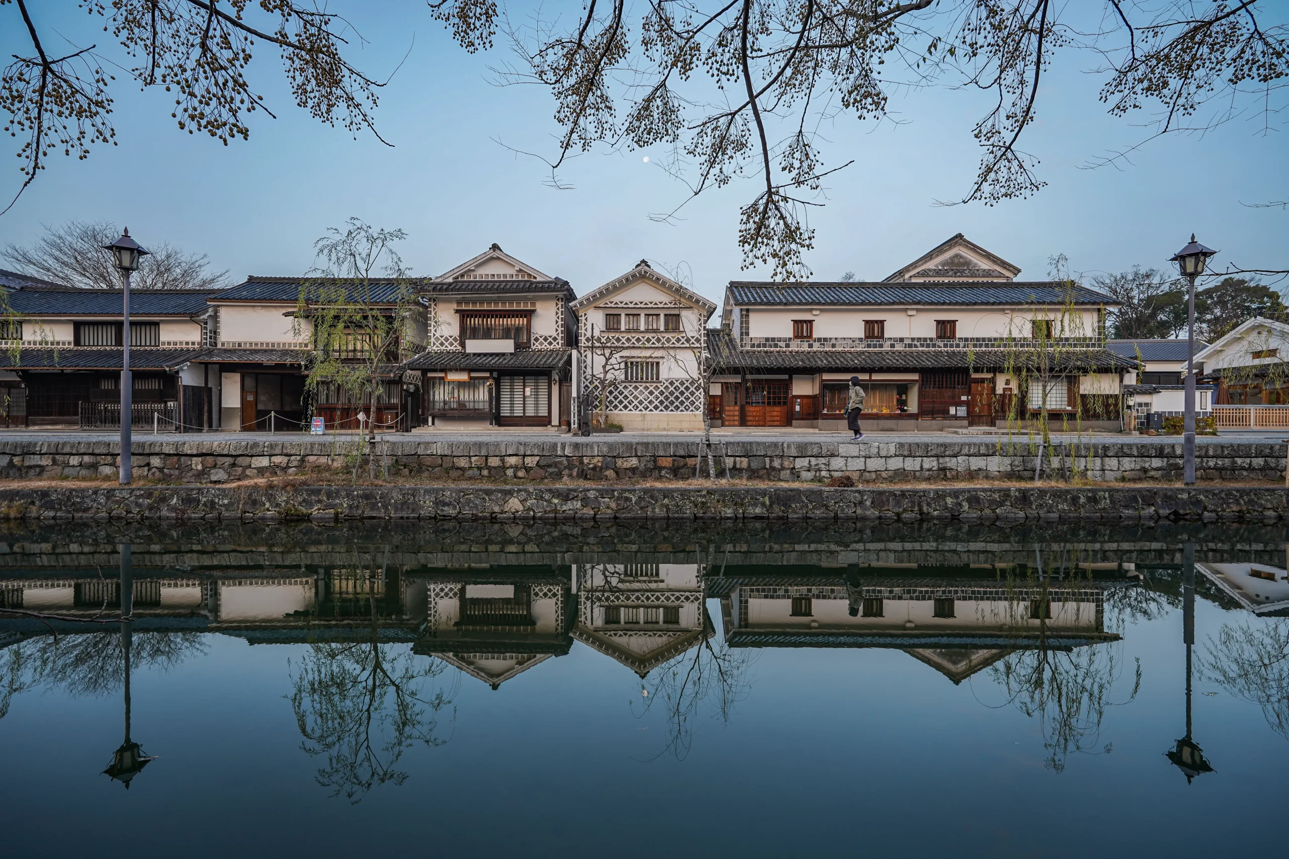 Traditional kura-style buildings along the canal in Kurashiki’s historic district