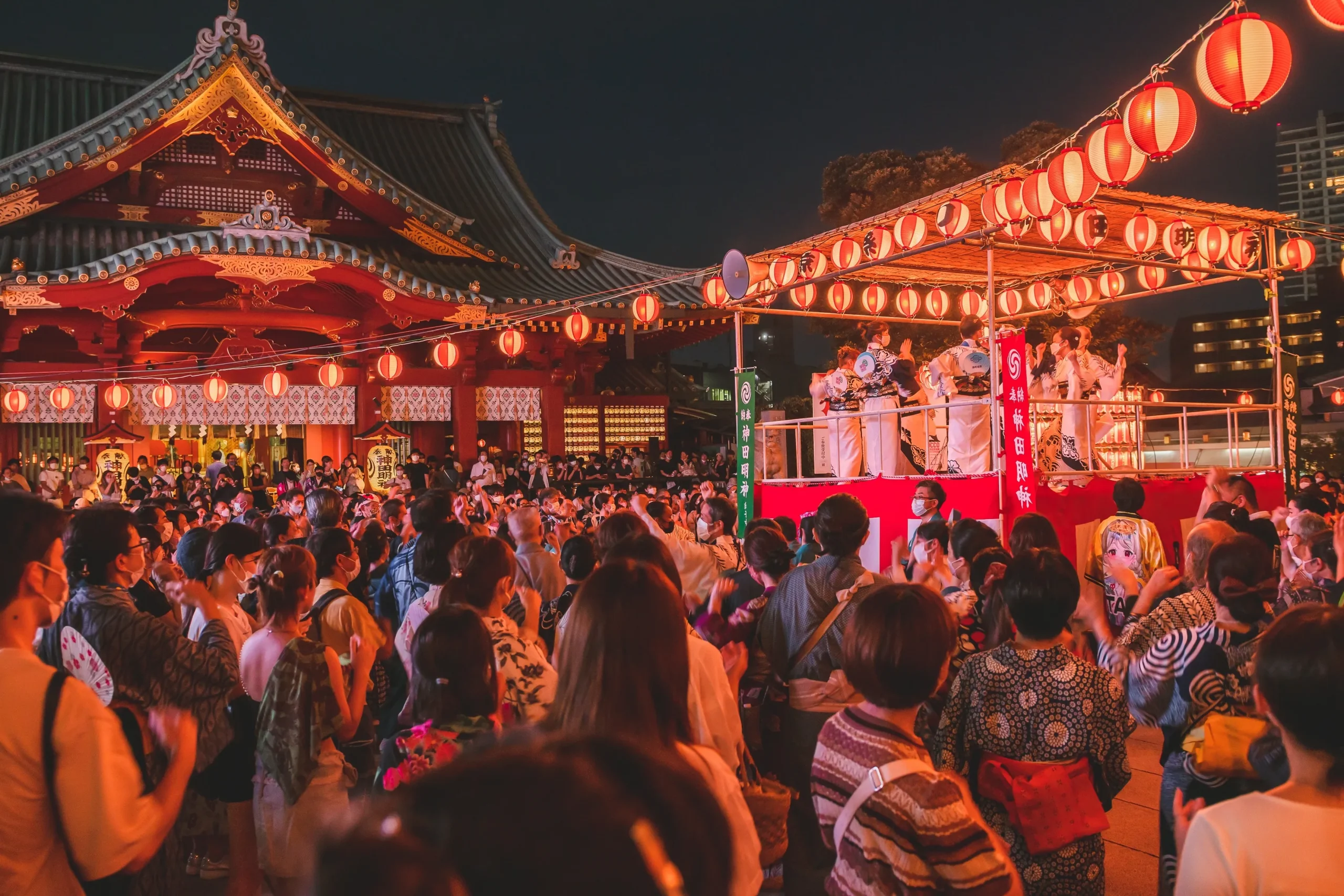 People dancing in yukata during Bon Odori summer festival at a Tokyo shrine