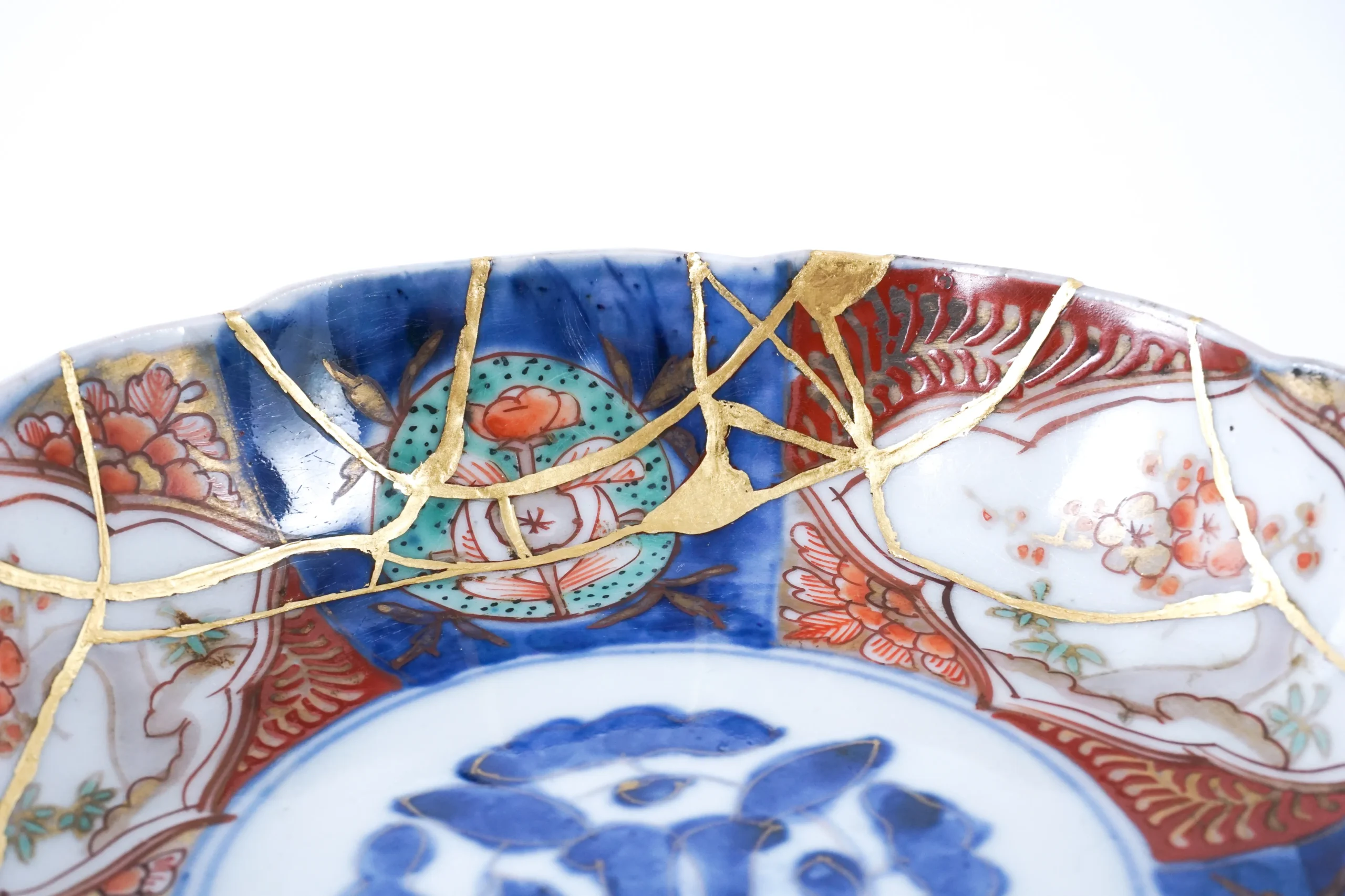 Traditional Imari porcelain plate restored with kintsugi gold repair, Japan