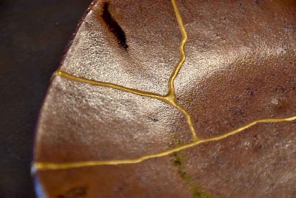 Traditional Imari porcelain plate restored with kintsugi gold repair, Japan