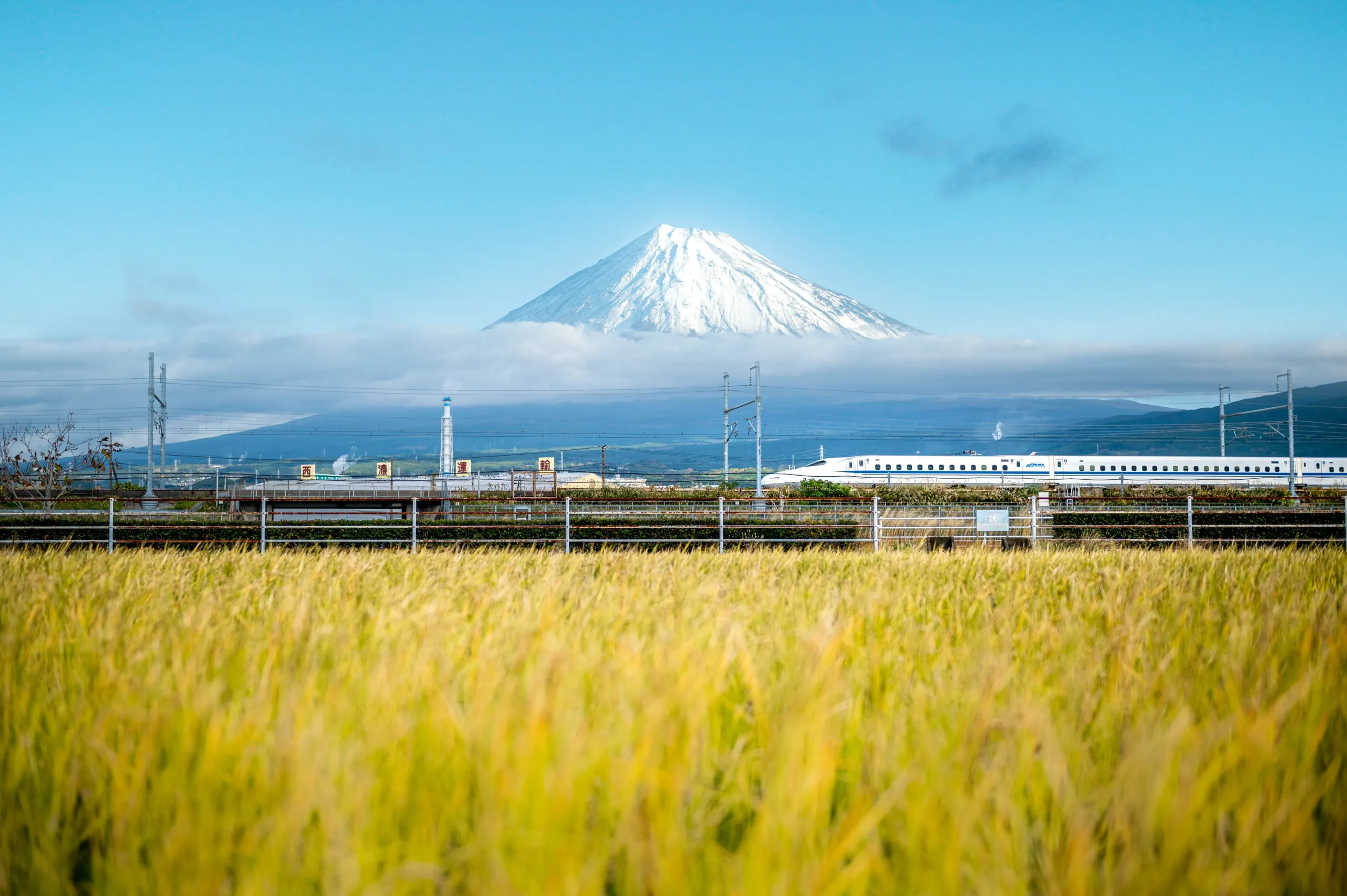 Shinkansen bullet train with Mount Fuji, Japan, iconic rail travel and mountain view