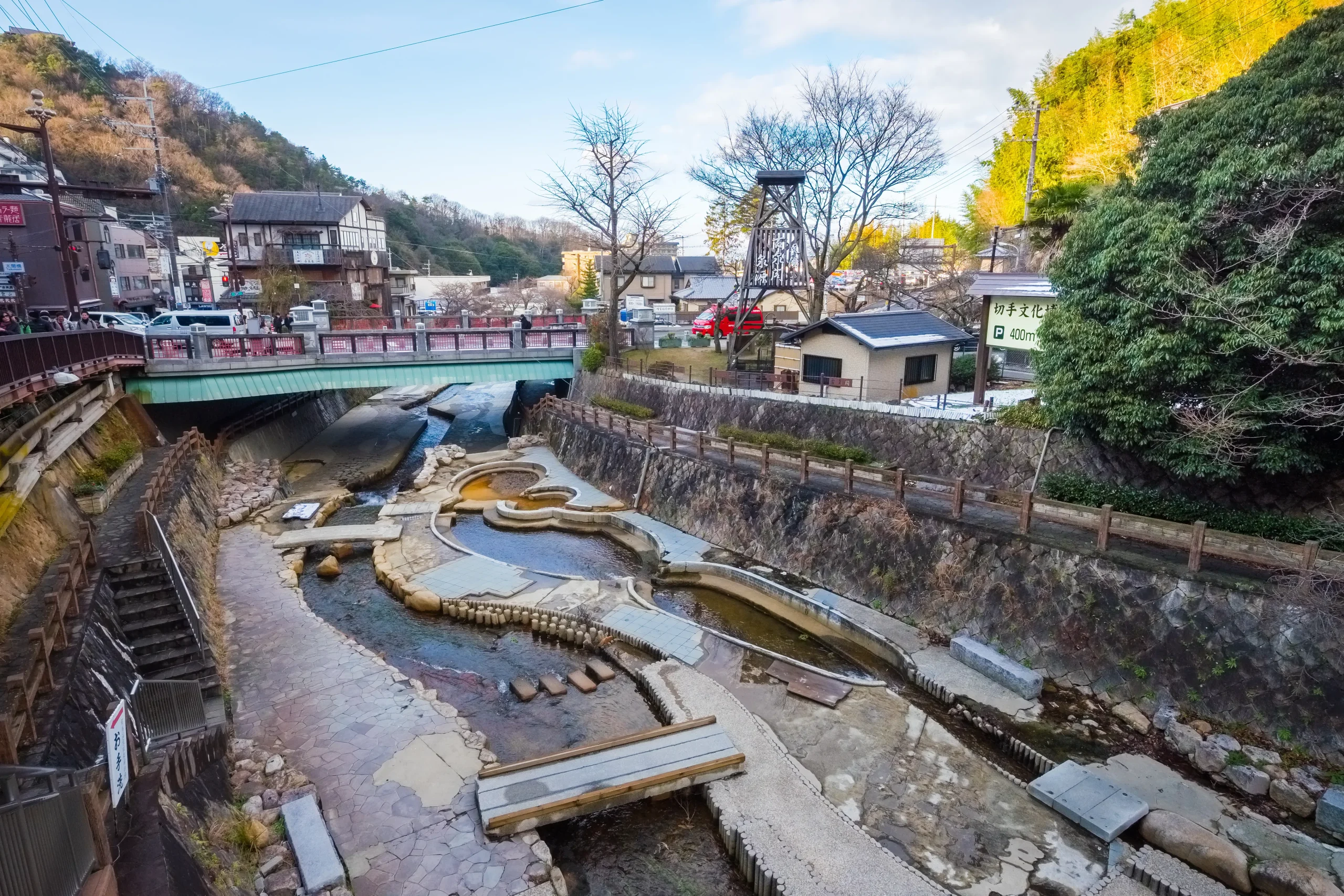 The scenic Arima River walk with traditional hot spring bridges in Arima Onsen.