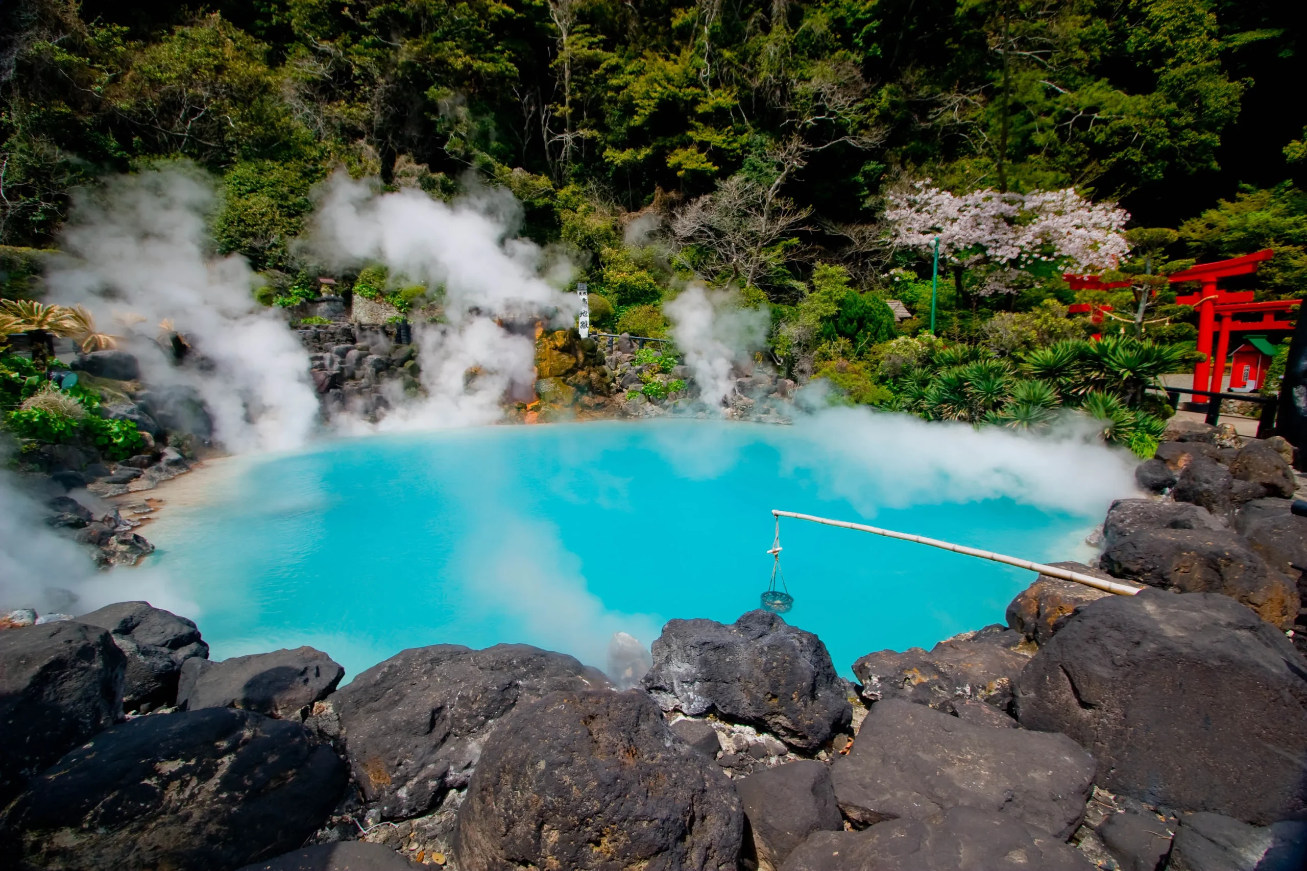 Umi Jigoku "Sea Hell" cobalt blue hot spring with steam in Beppu Onsen, Kyushu.