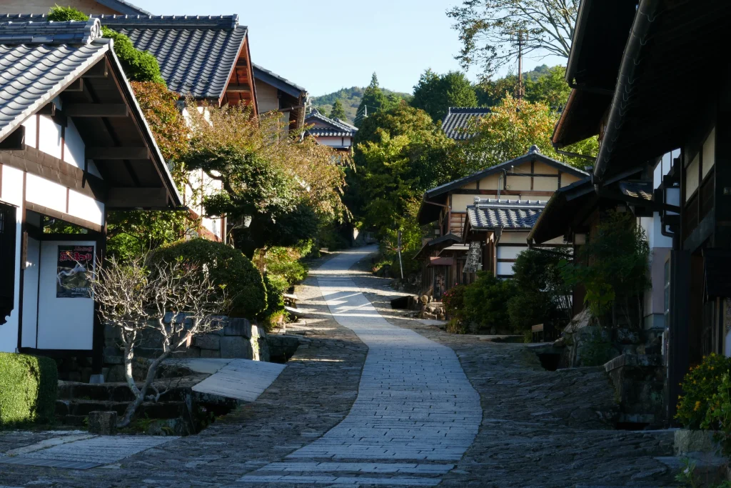 Historic wooden buildings and a winding path in Magome, a preserved Edo-period town.