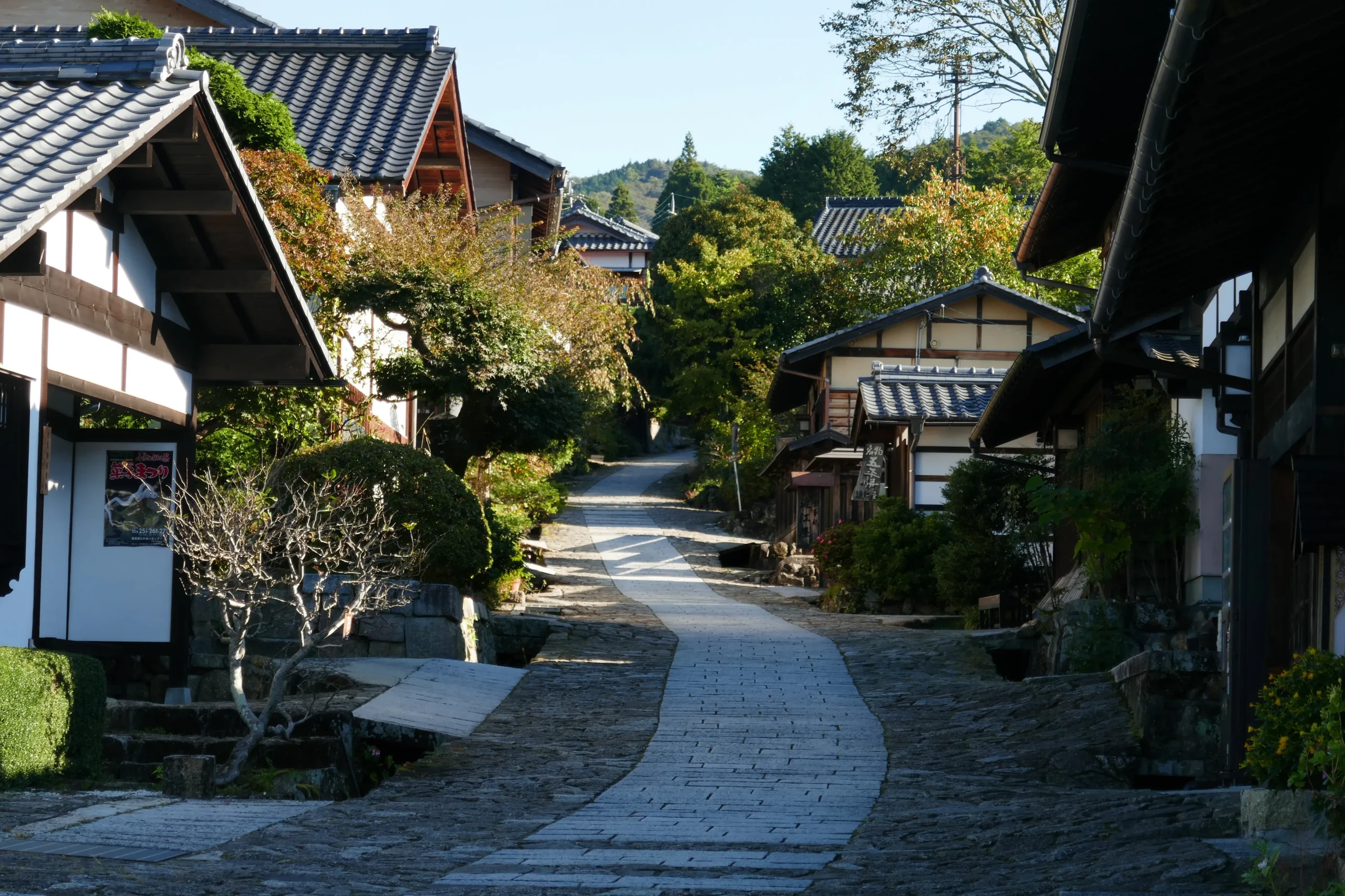 Historic wooden buildings and a winding path in Magome, a preserved Edo-period town.