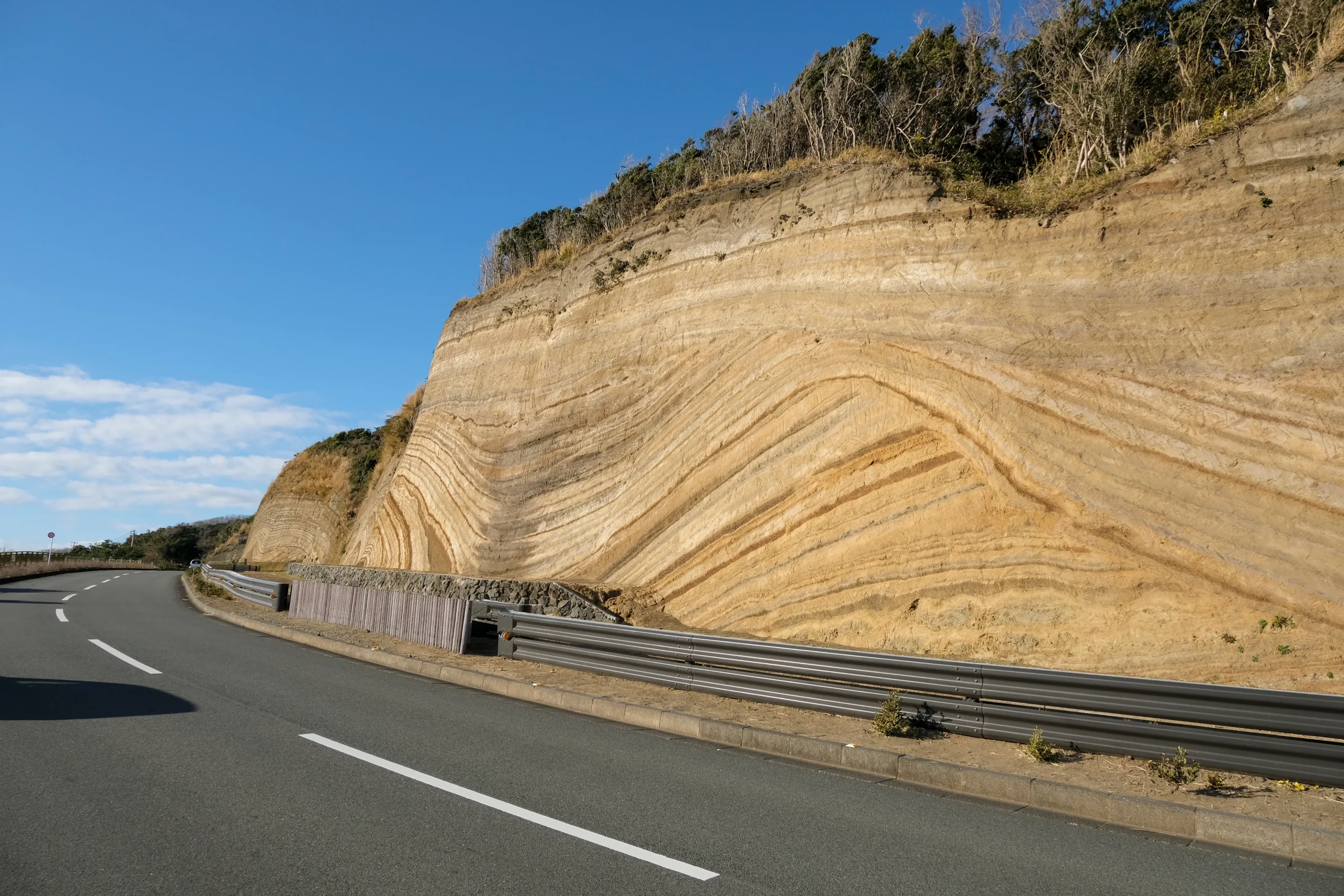 Unique volcanic geological strata layers along the driveway in Izu Oshima.