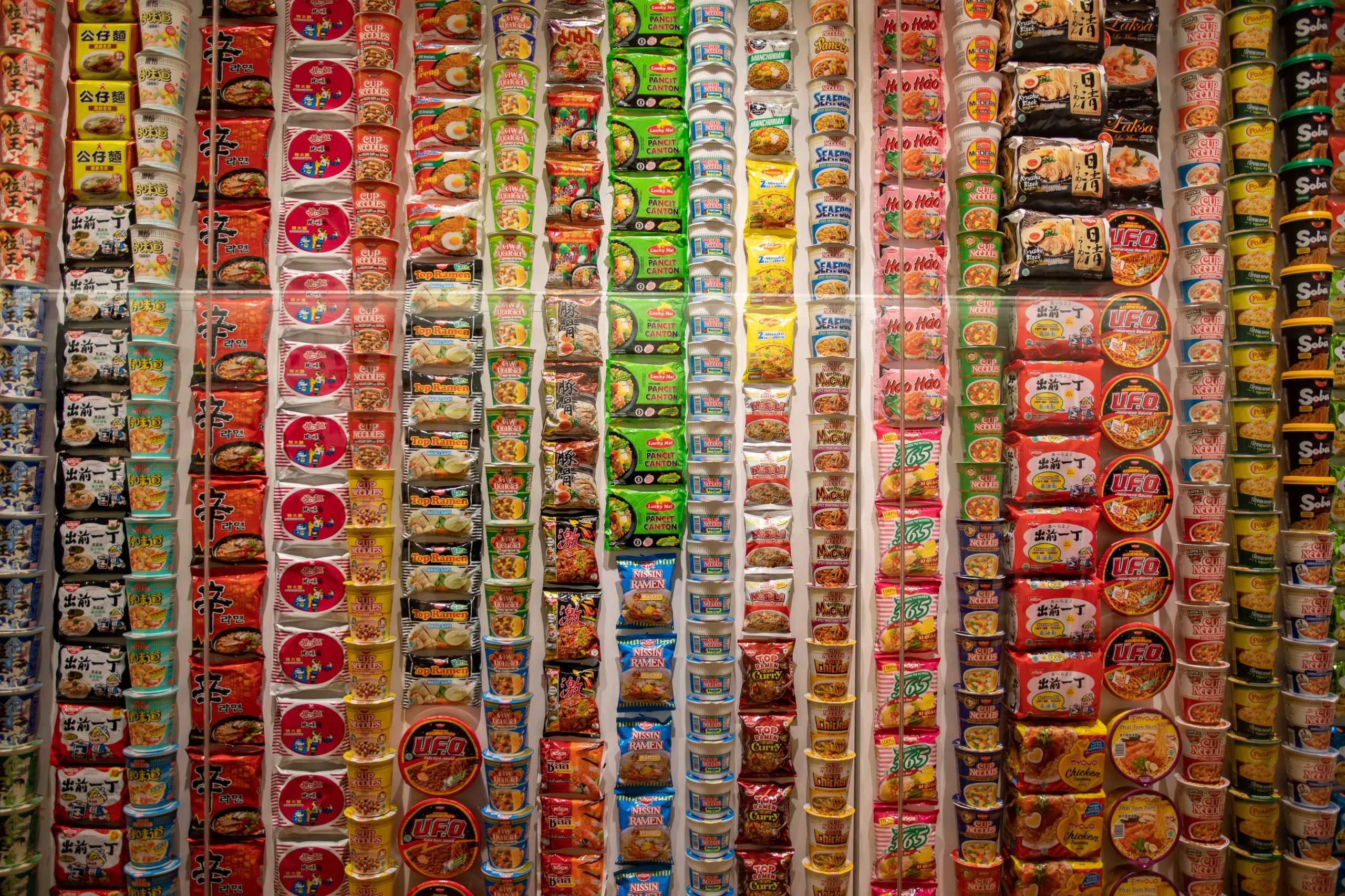 Instant noodle wall display at Cup Noodles Museum Yokohama featuring global ramen varieties