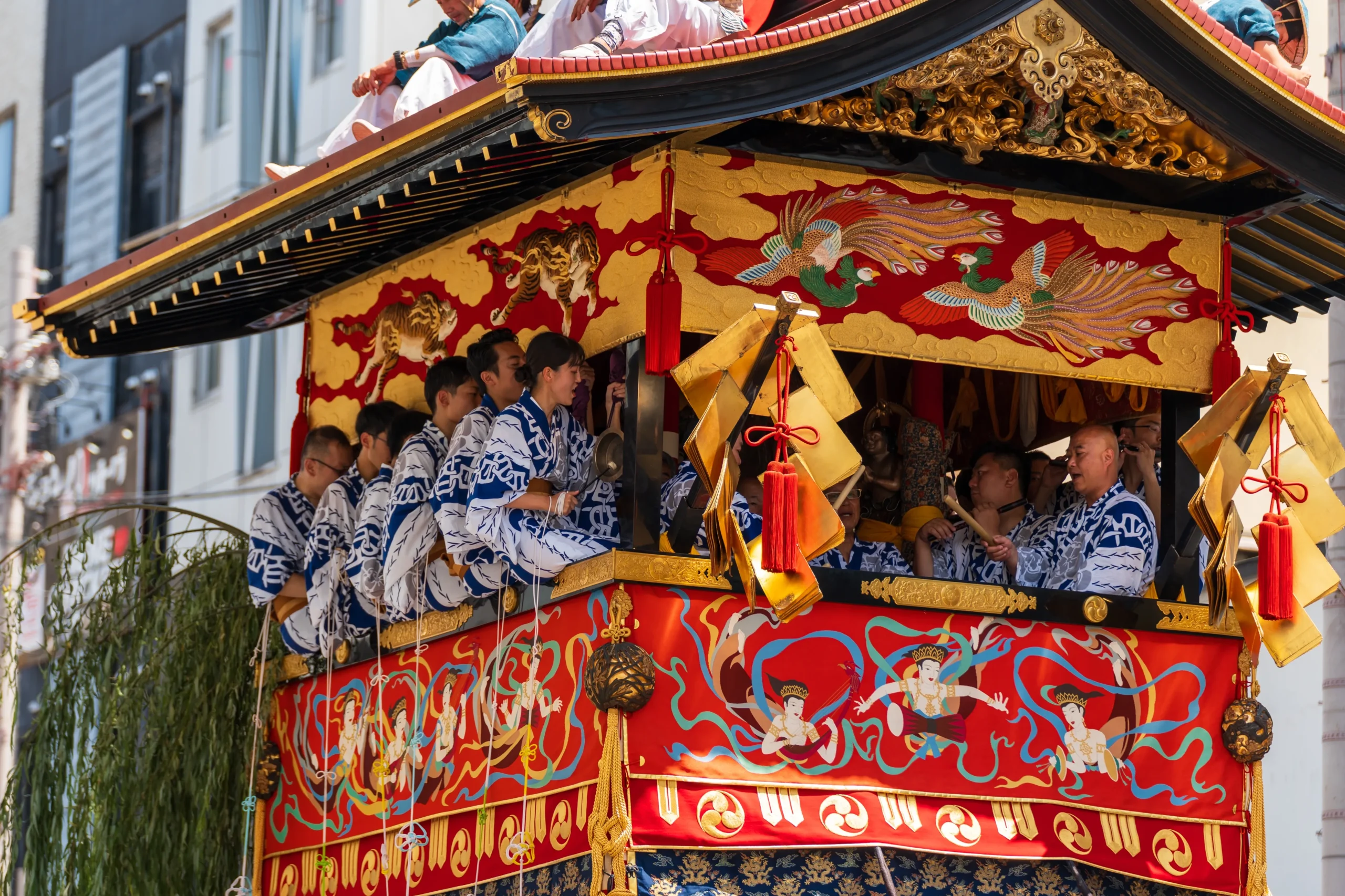 Ornately decorated Gion Matsuri festival float with musicians and traditional Kyoto craftsmanship