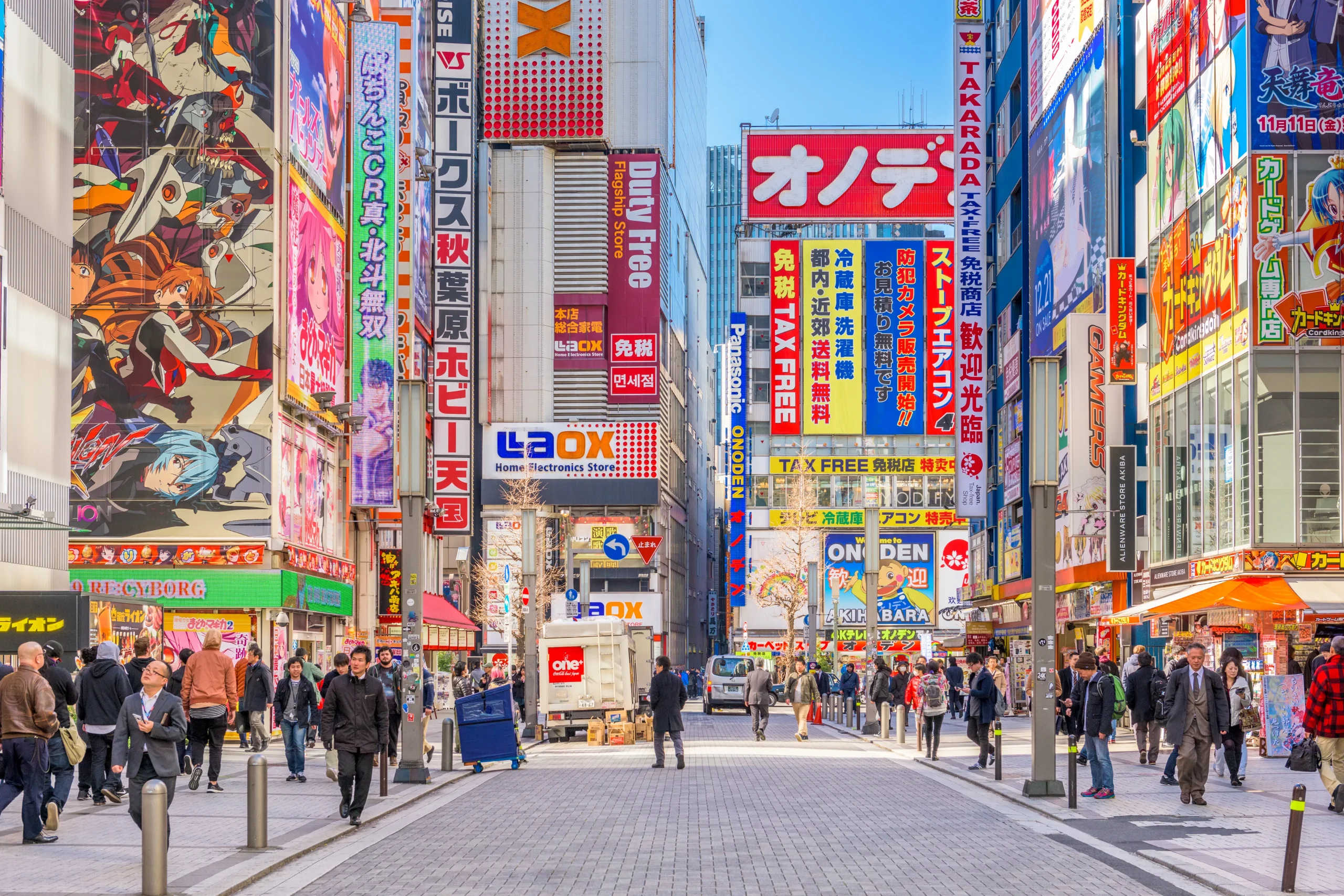 Bustling Akihabara streets lined with colorful anime billboards, arcades, and electronics stores in Tokyo