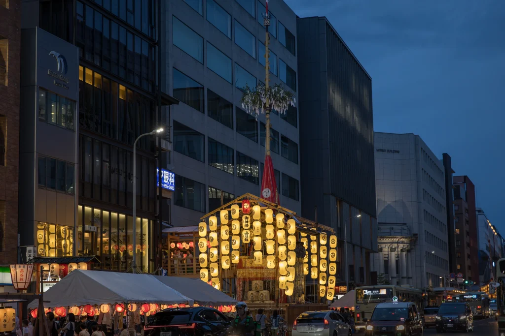 Gion Matsuri float illuminated at night along Kyoto’s main street during the summer festival