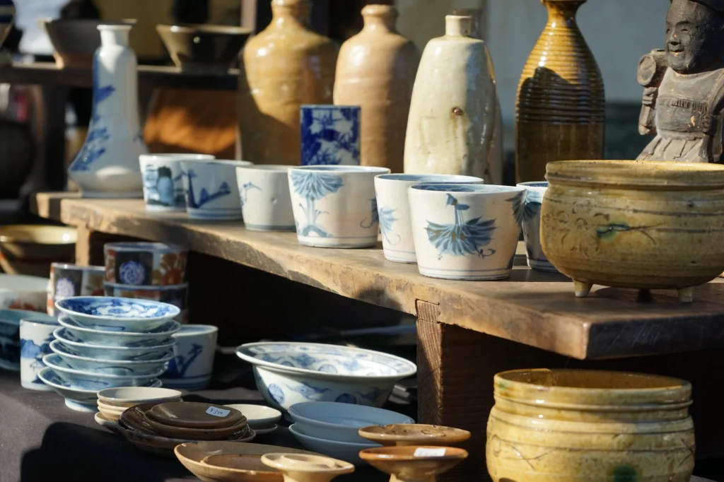 Traditional Japanese pottery and porcelain cups arranged at the Oedo Antique Market in Tokyo