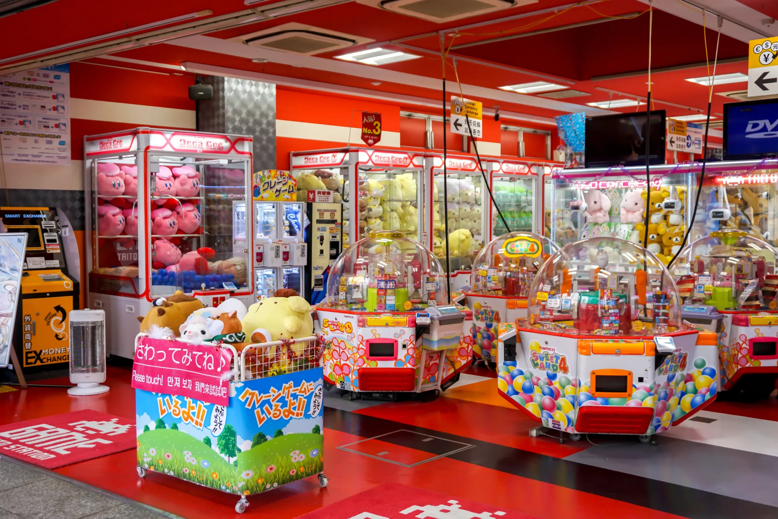 Bright claw machines and colorful arcade games inside Osaka’s Den-den Town entertainment district