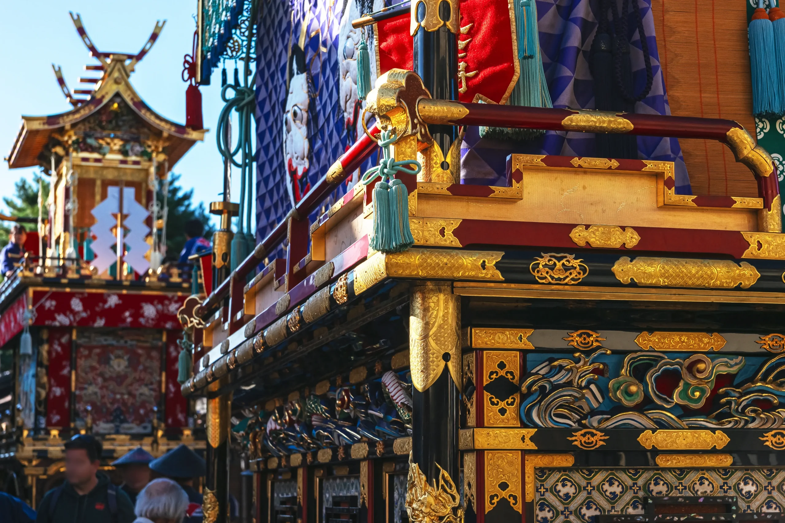 Close-up view of ornate Takayama Autumn Festival floats featuring intricate gold carvings, lacquerwork, and traditional craftsmanship