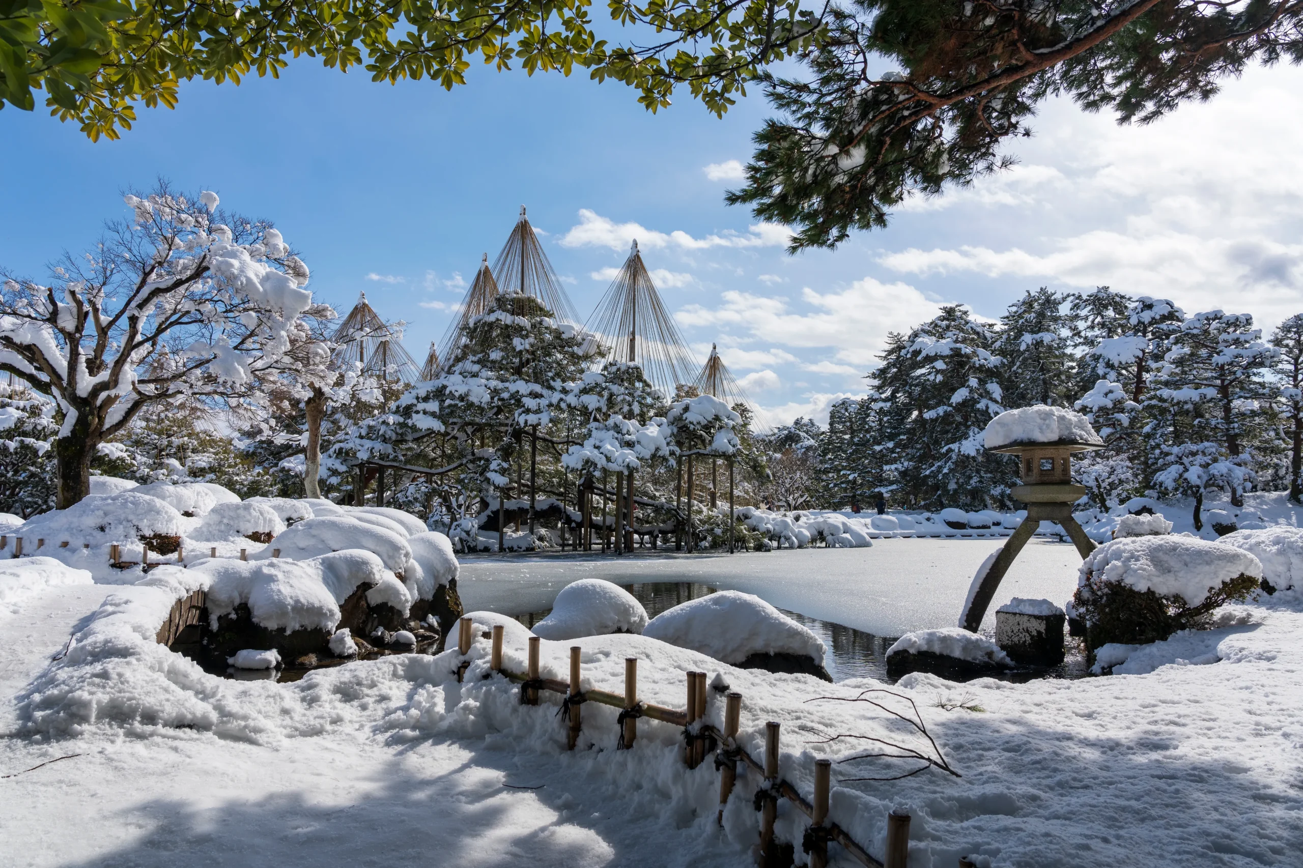 Kenrokuen Garden in Kanazawa covered in snow with traditional yukitsuri ropes