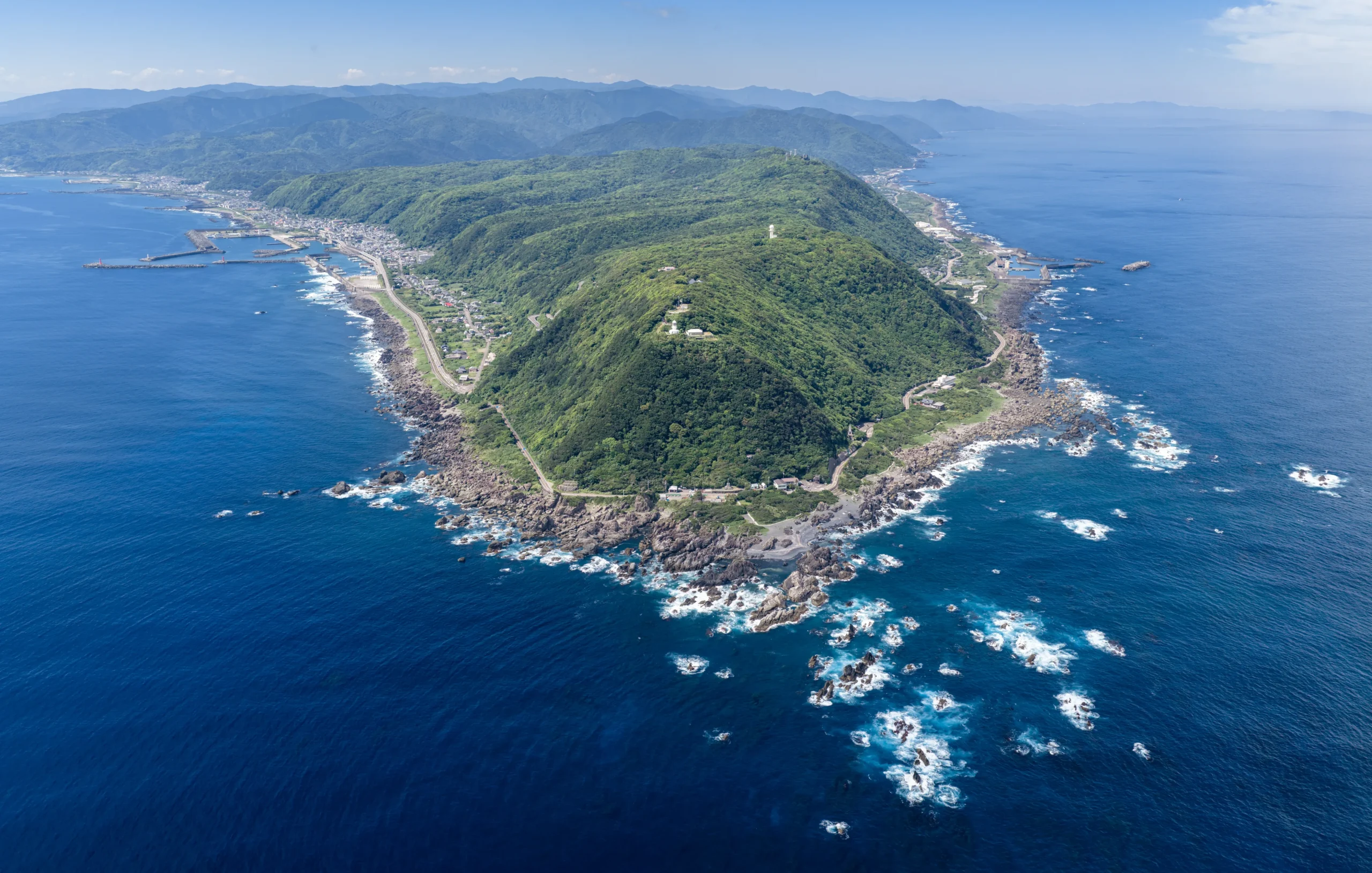 Aerial view of Cape Muroto with rugged coastline and blue ocean in Kochi