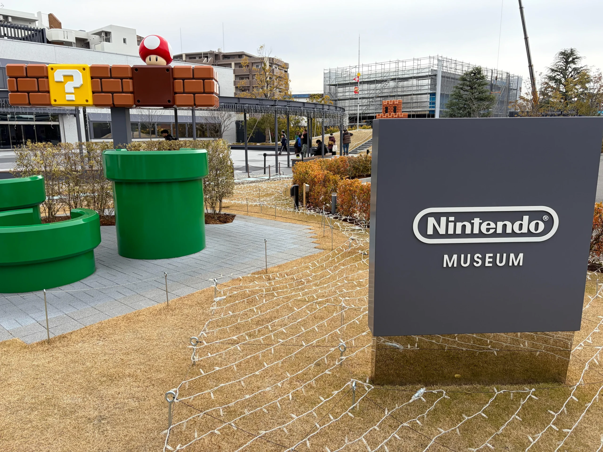 Entrance sign and Super Mario pipe decorations at the Nintendo Museum in Kyoto