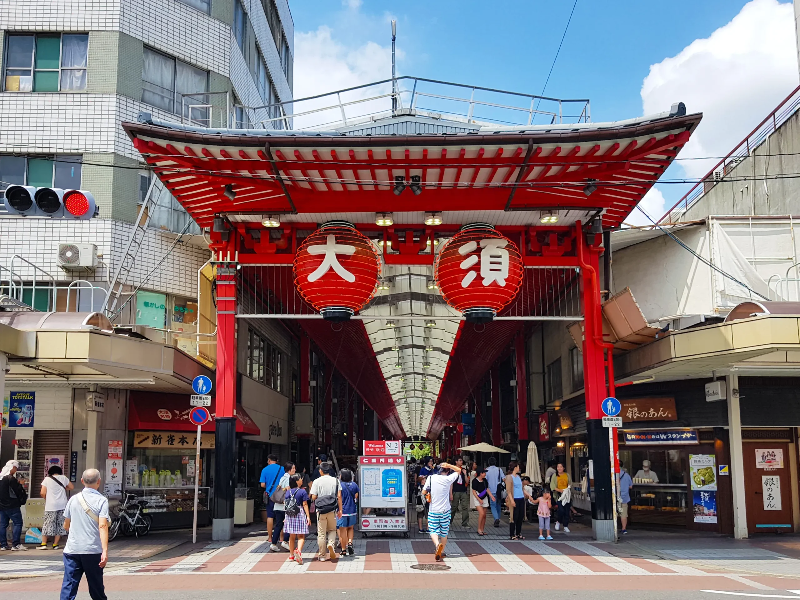 Red gate with lanterns at the entrance to Osu Shopping District in Nagoya