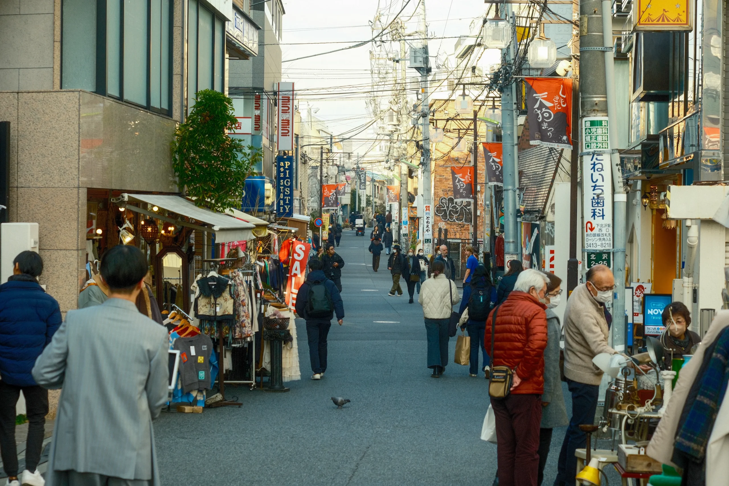 Shoppers browsing vintage and thrift stores along a Shimokitazawa street in Tokyo