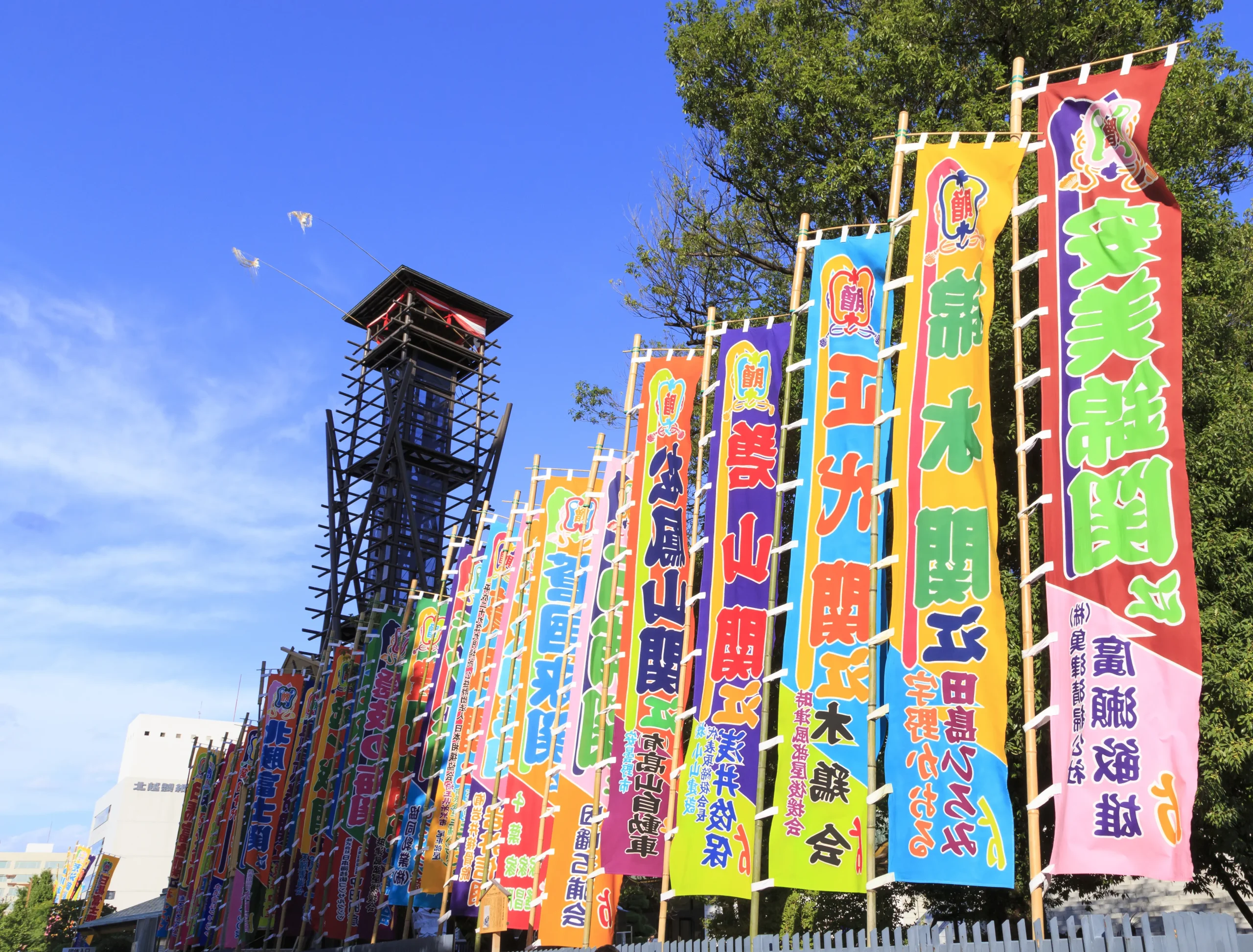 Colorful sumo banners and the yagura drum tower outside Ryogoku Kokugikan in Tokyo