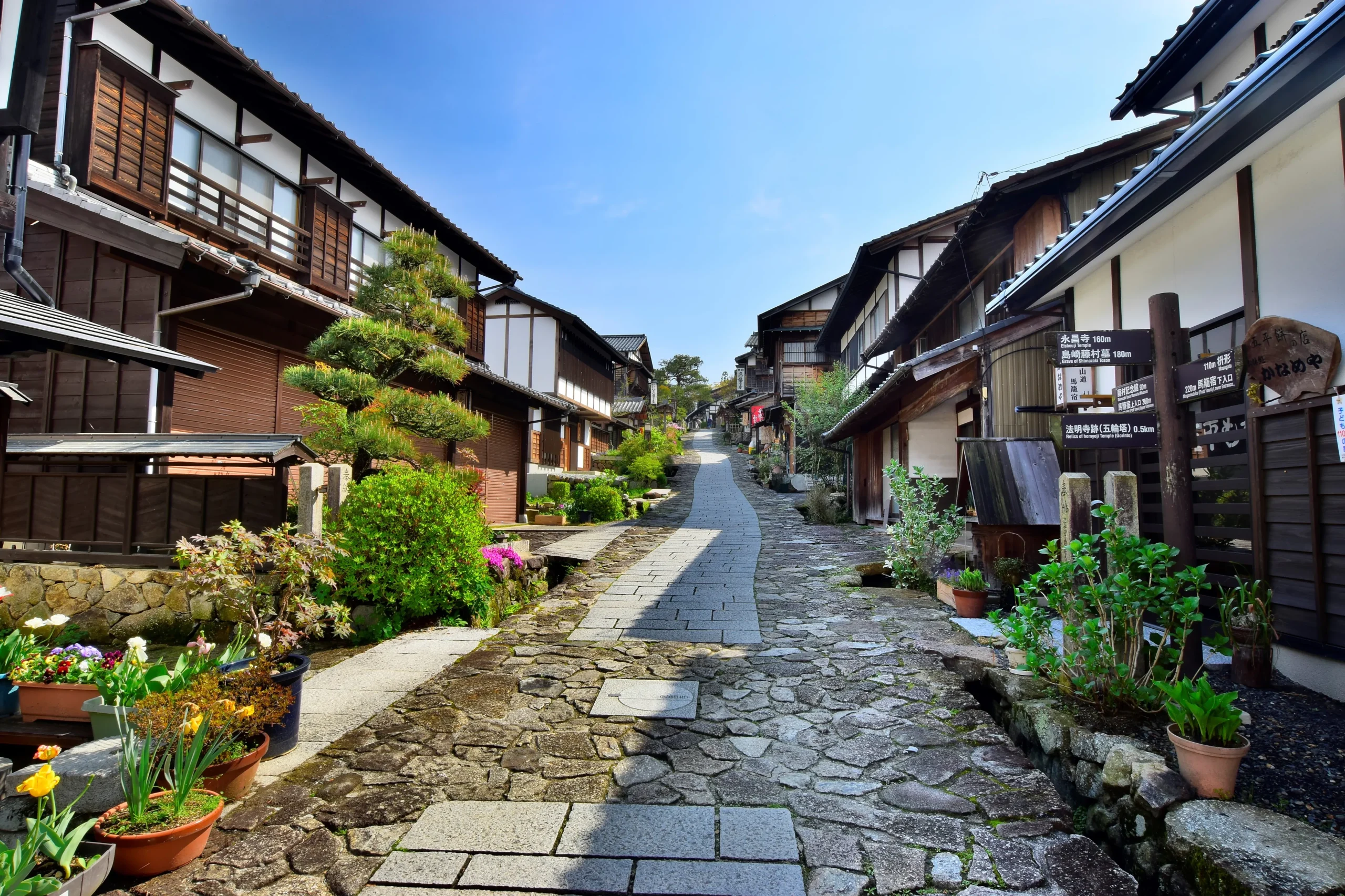 Stone-paved street lined with old wooden inns at Magome-juku post town on the Nakasendo