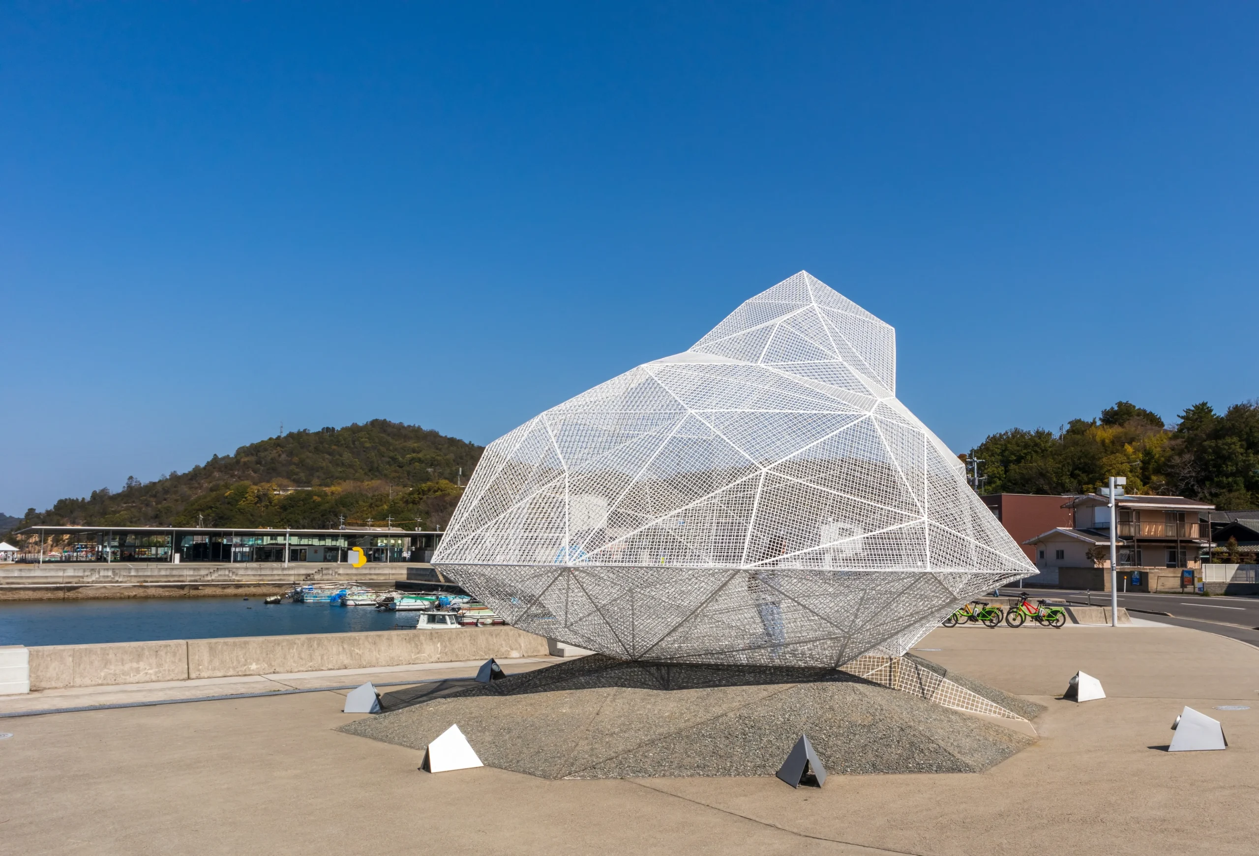 Naoshima Pavilion, a white geometric mesh sculpture near the harbor on Naoshima