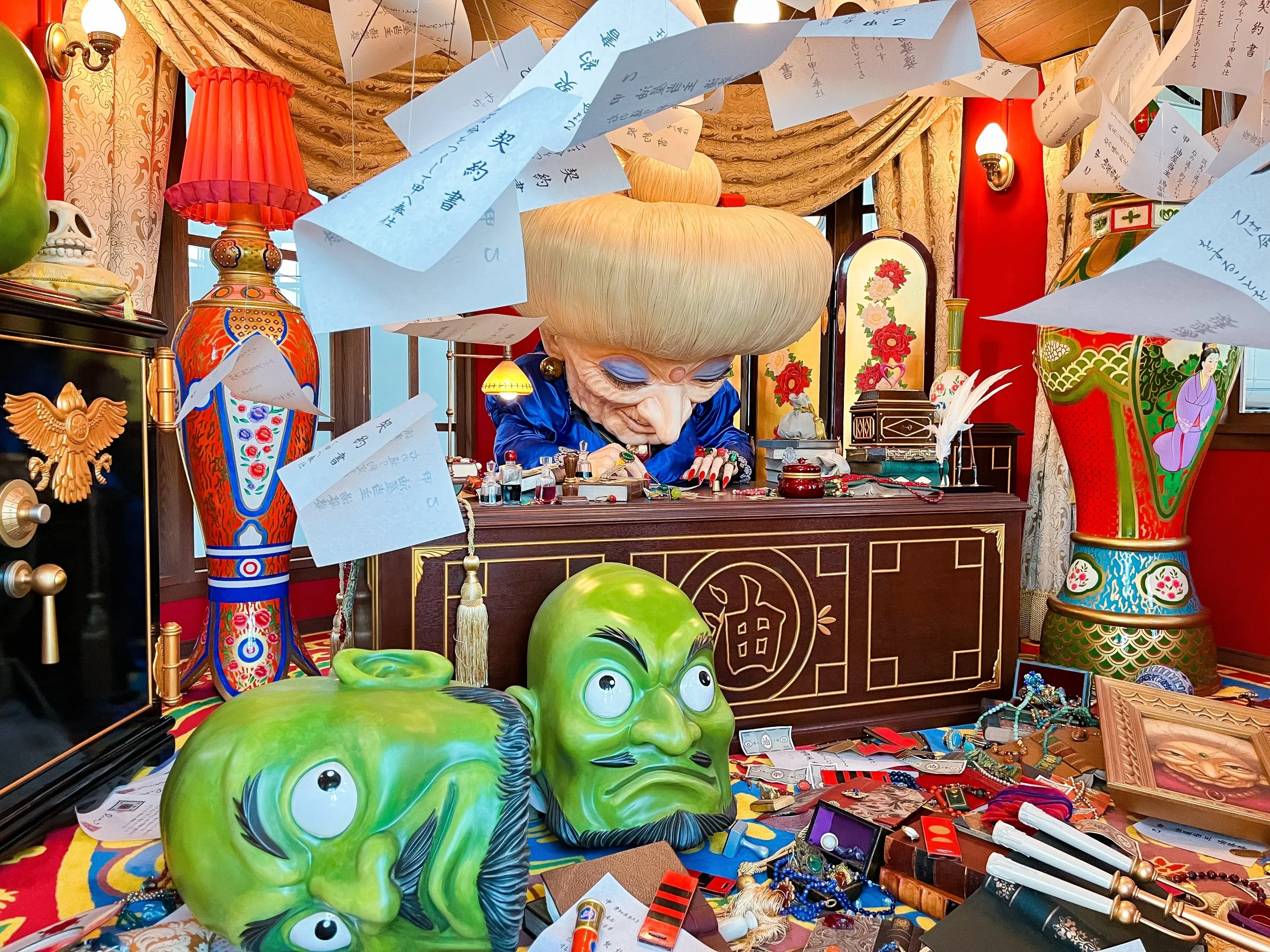 Recreated scene of Yubaba's office from Spirited Away inside Ghibli's Grand Warehouse at Ghibli Park, with flying contract papers