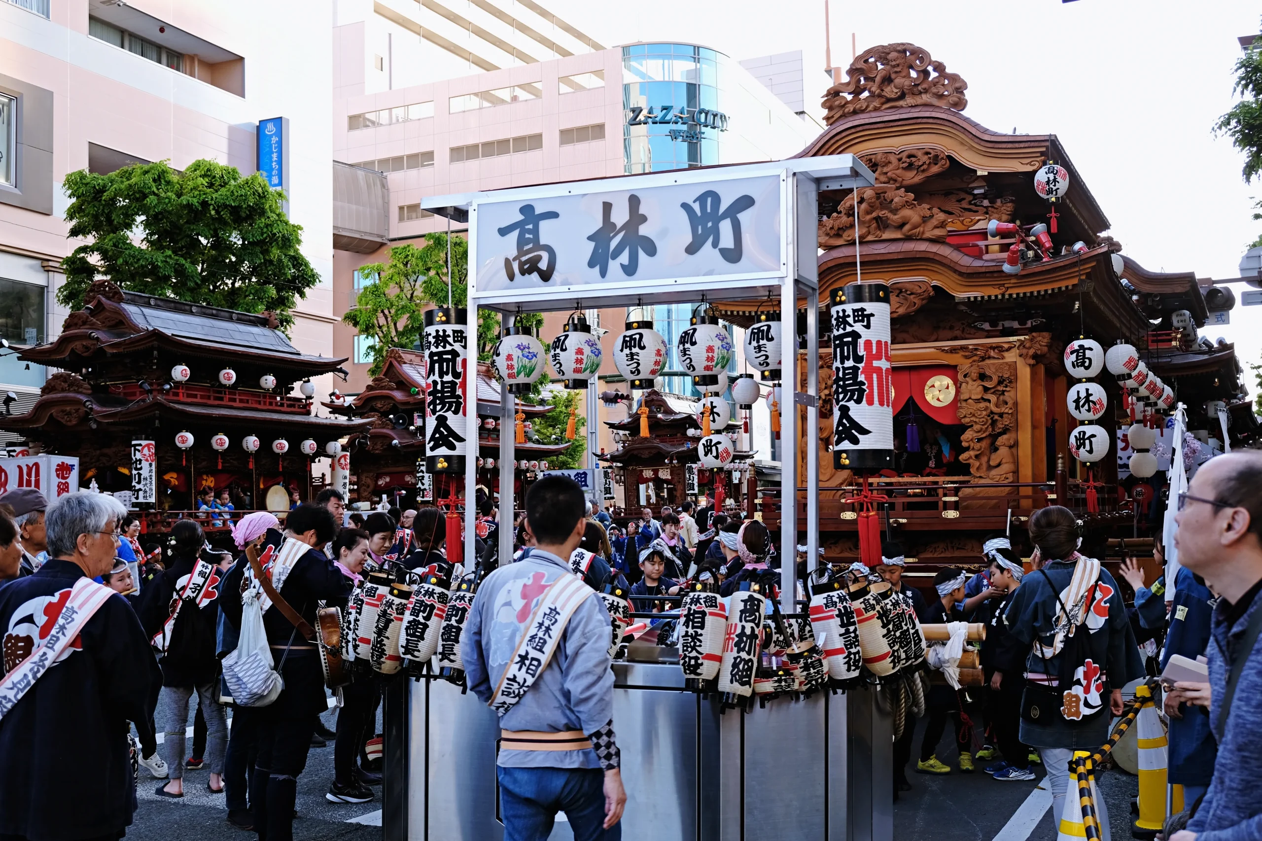 Crowds and elaborately carved festival floats during the Hamamatsu Festival in Shizuoka, Japan