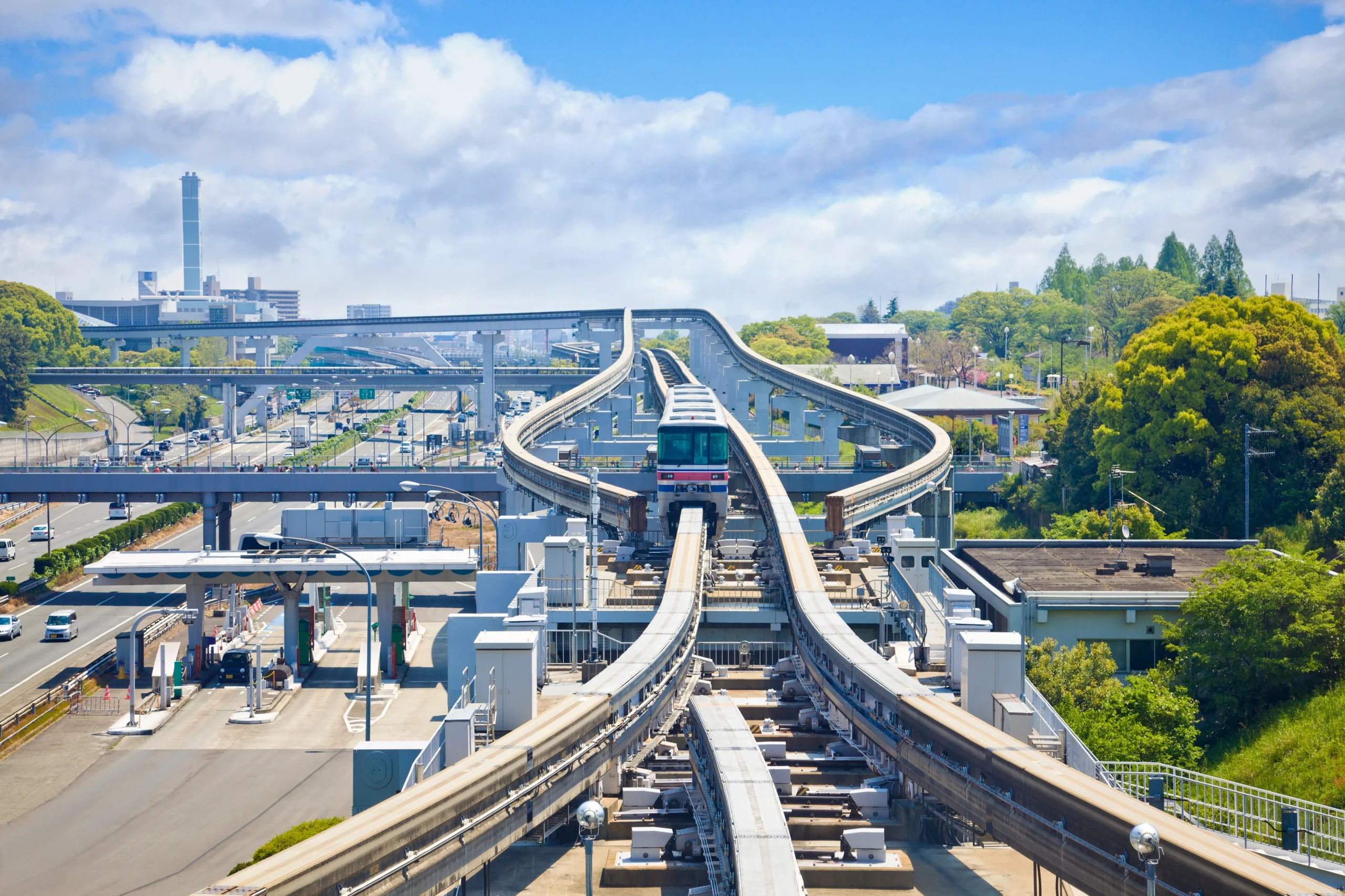 Osaka Monorail traveling along an elevated track