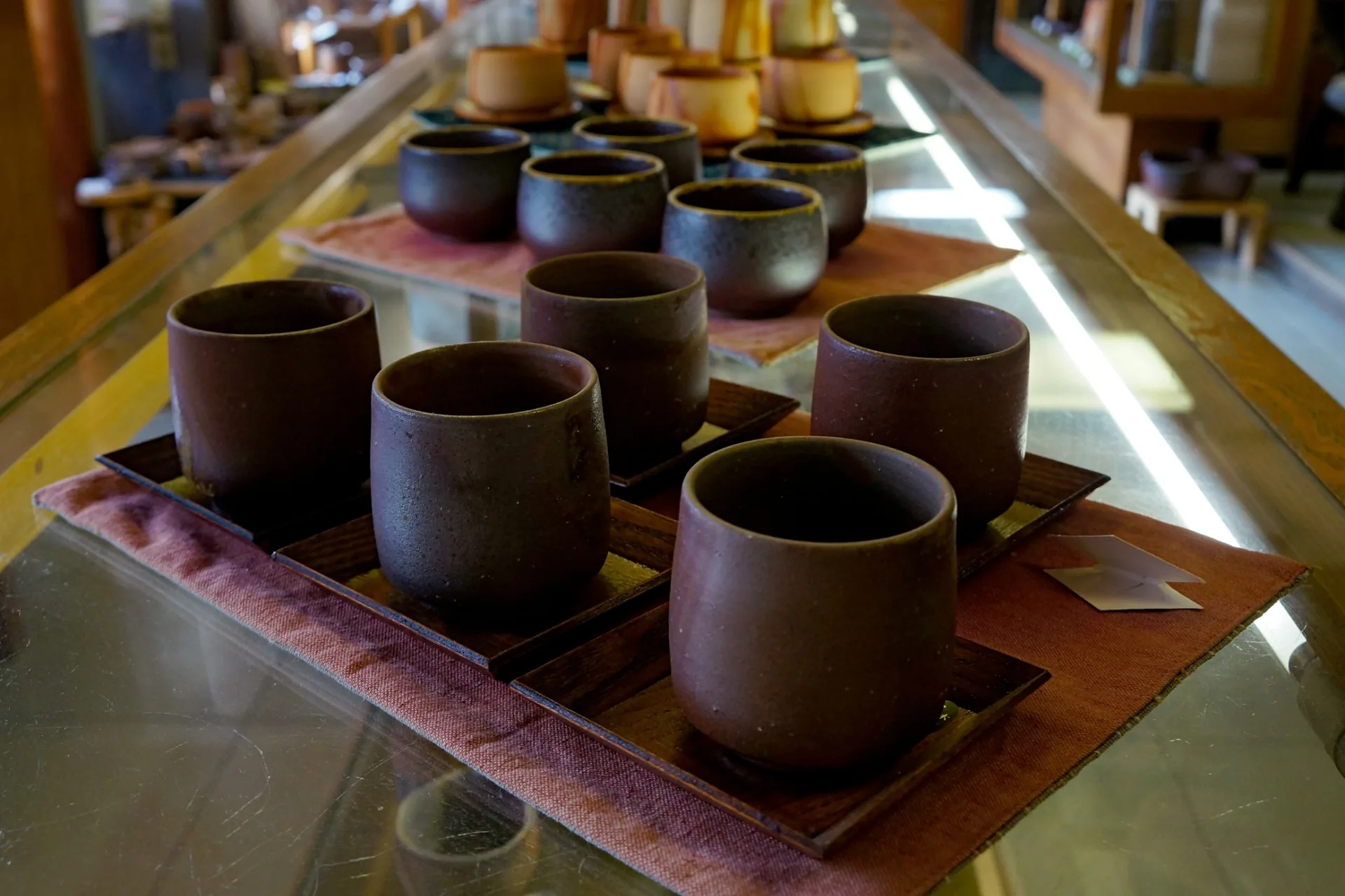 Bizen ware cups displayed in Imbe showing natural variations from kiln firing