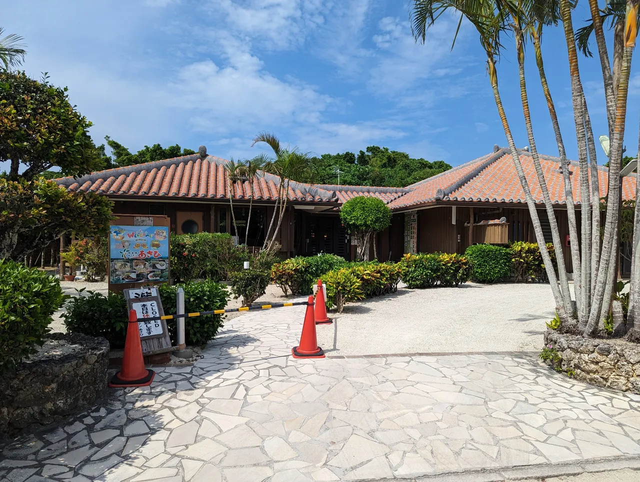 Traditional red-tiled houses and tropical streetscape on Taketomi Island, Okinawa