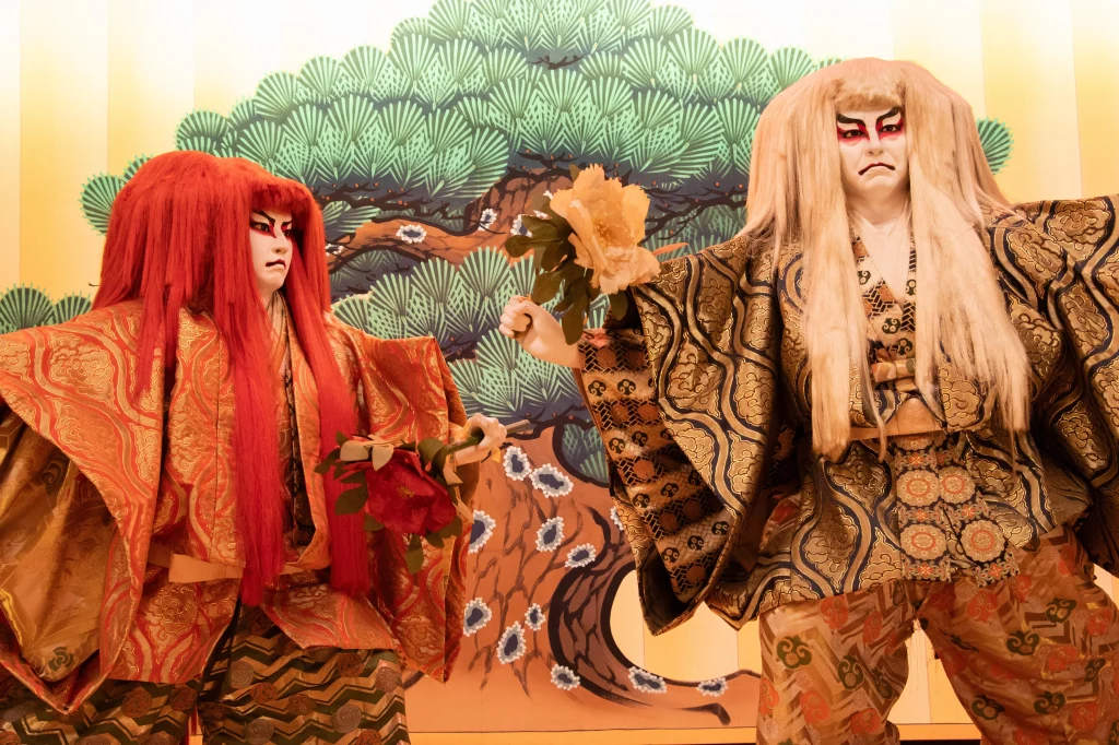 Kabuki dolls depicting Renjishi characters with red and white hair.
