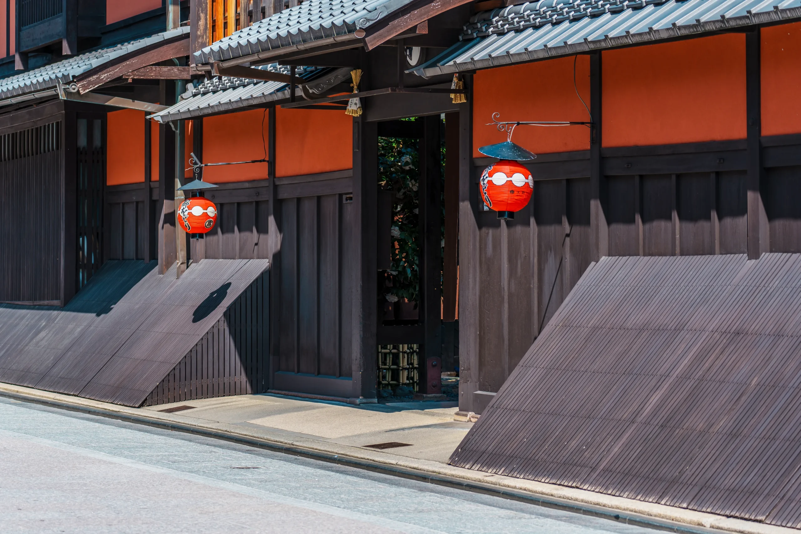Ichiriki-tei and Miyako Odori lanterns along a street in Gion, Kyoto, in spring.